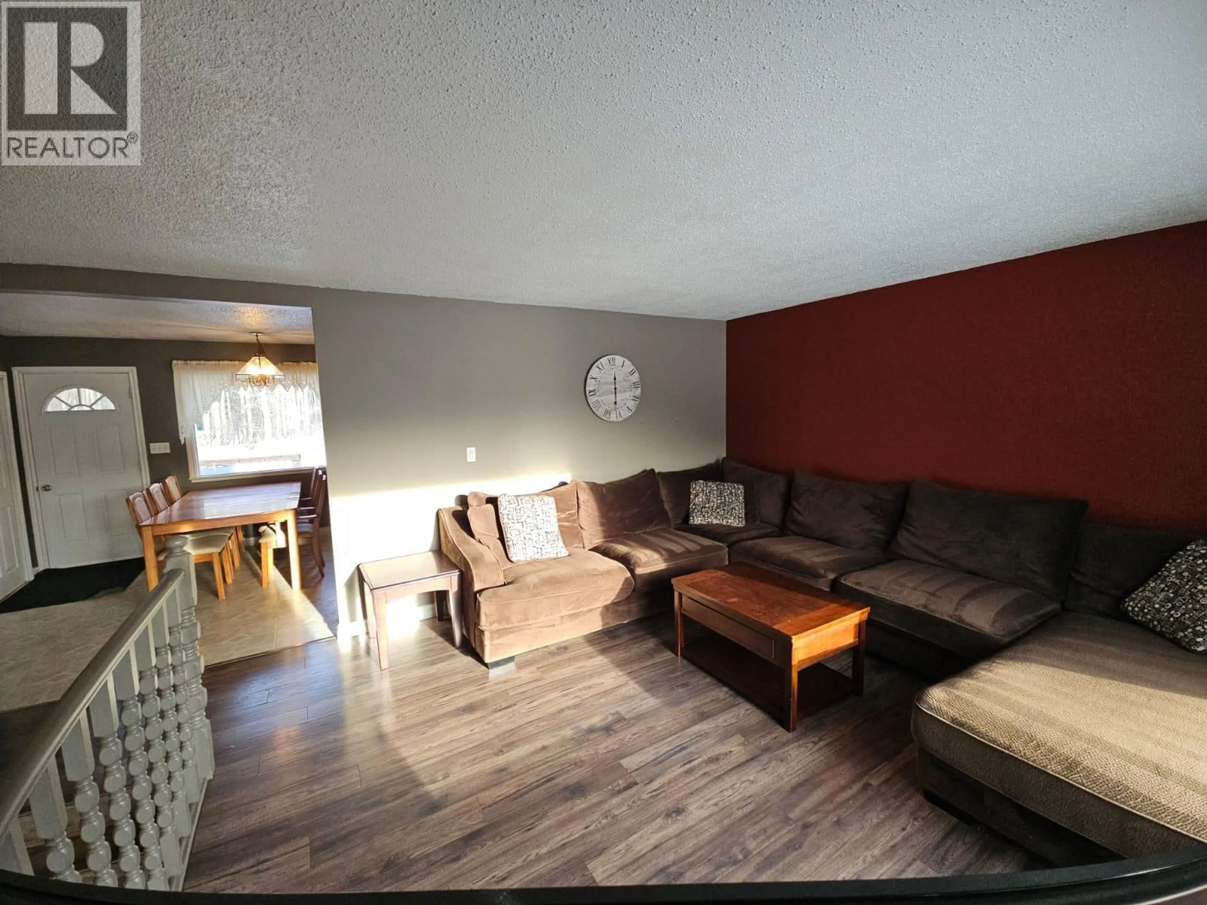 Living room with furniture, wood/laminate floor for 4320 47 AVENUE NORTHEAST, Chetwynd British Columbia V0C1J0