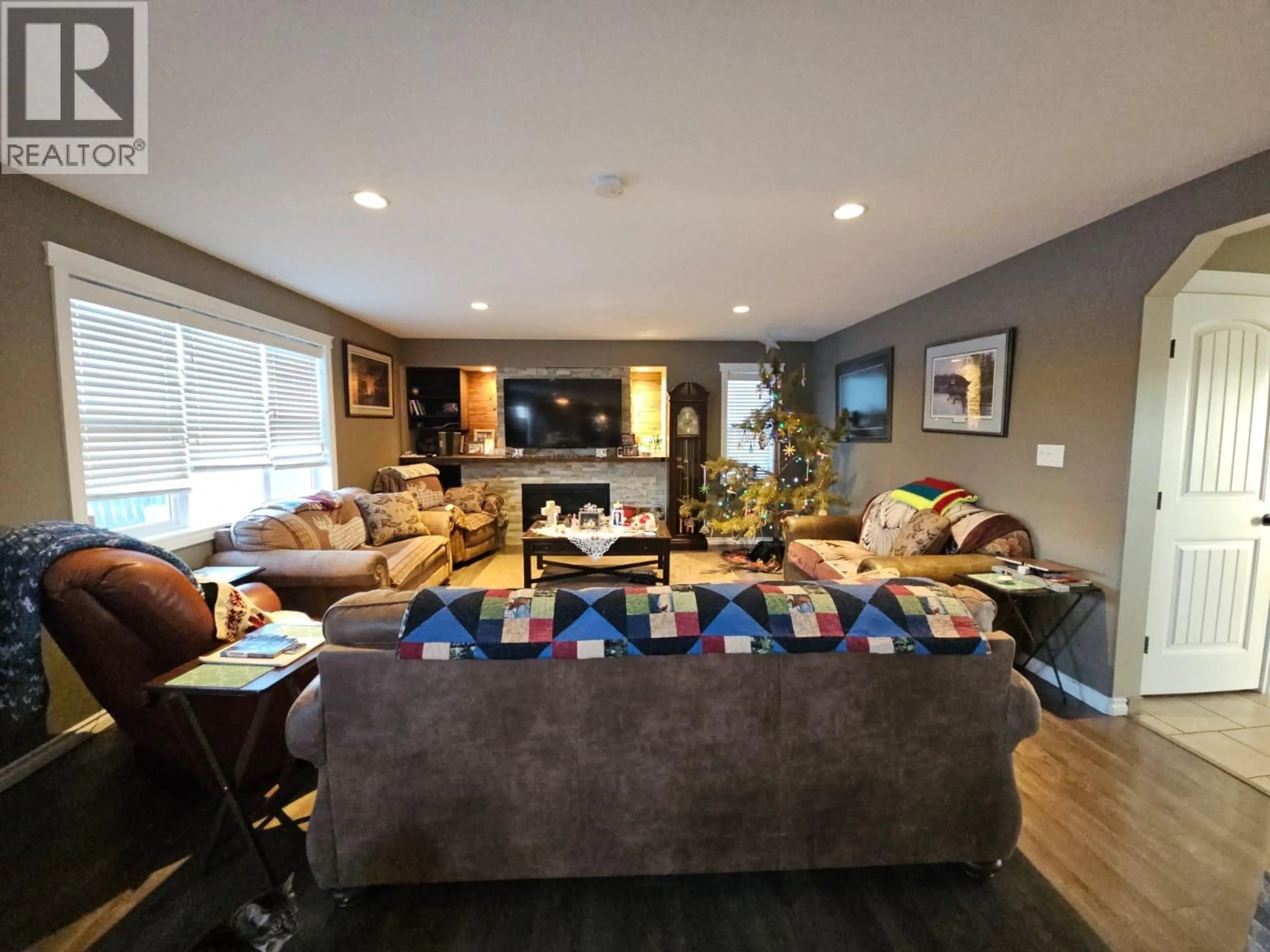 Living room with furniture, wood/laminate floor for 4804 BISSETTE DRIVE, Pouce Coupe British Columbia V0C2C0
