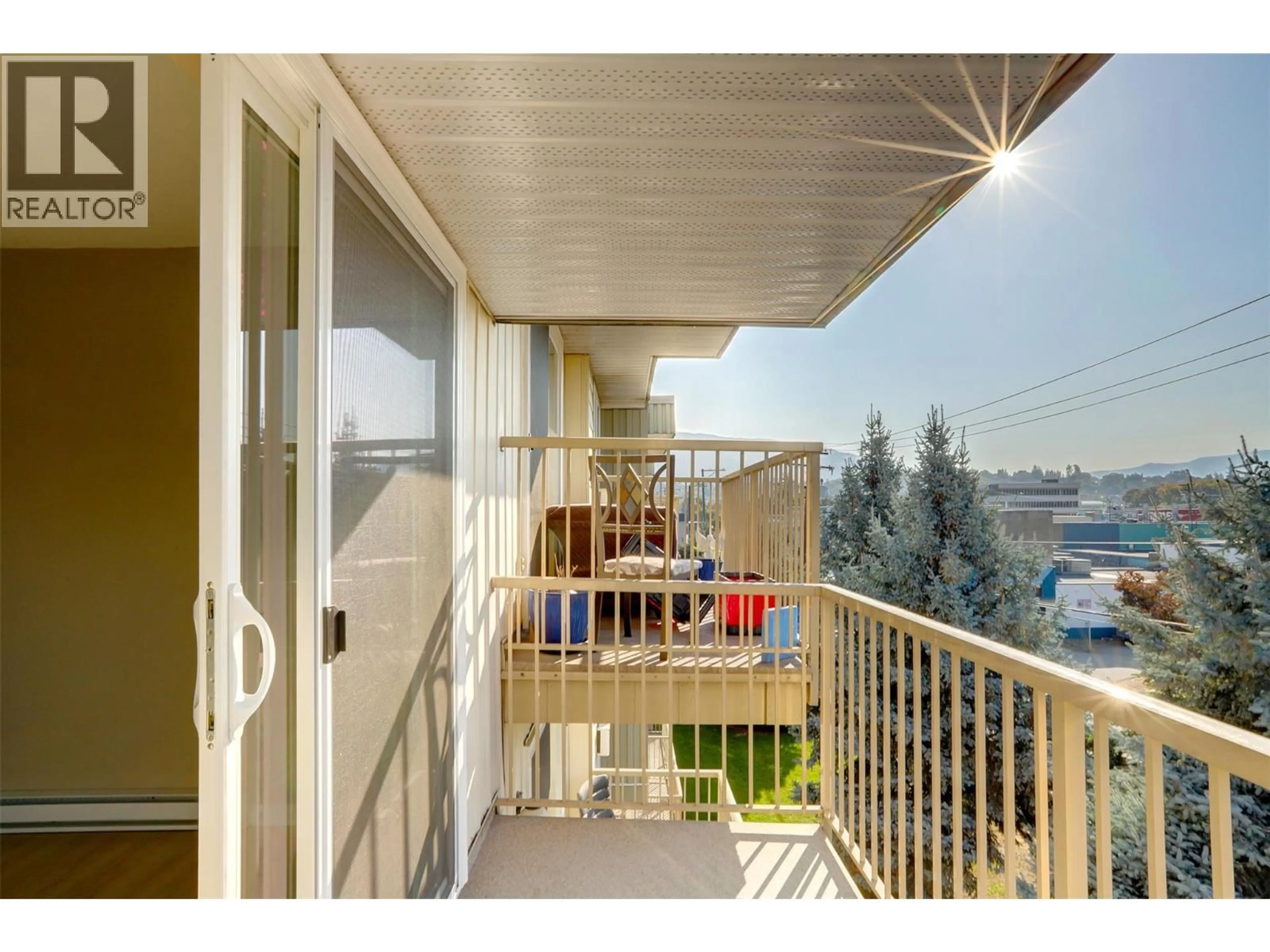Balcony in the apartment, city buildings view from balcony for 415 - 3304 35 AVENUE, Vernon British Columbia V1T8M6