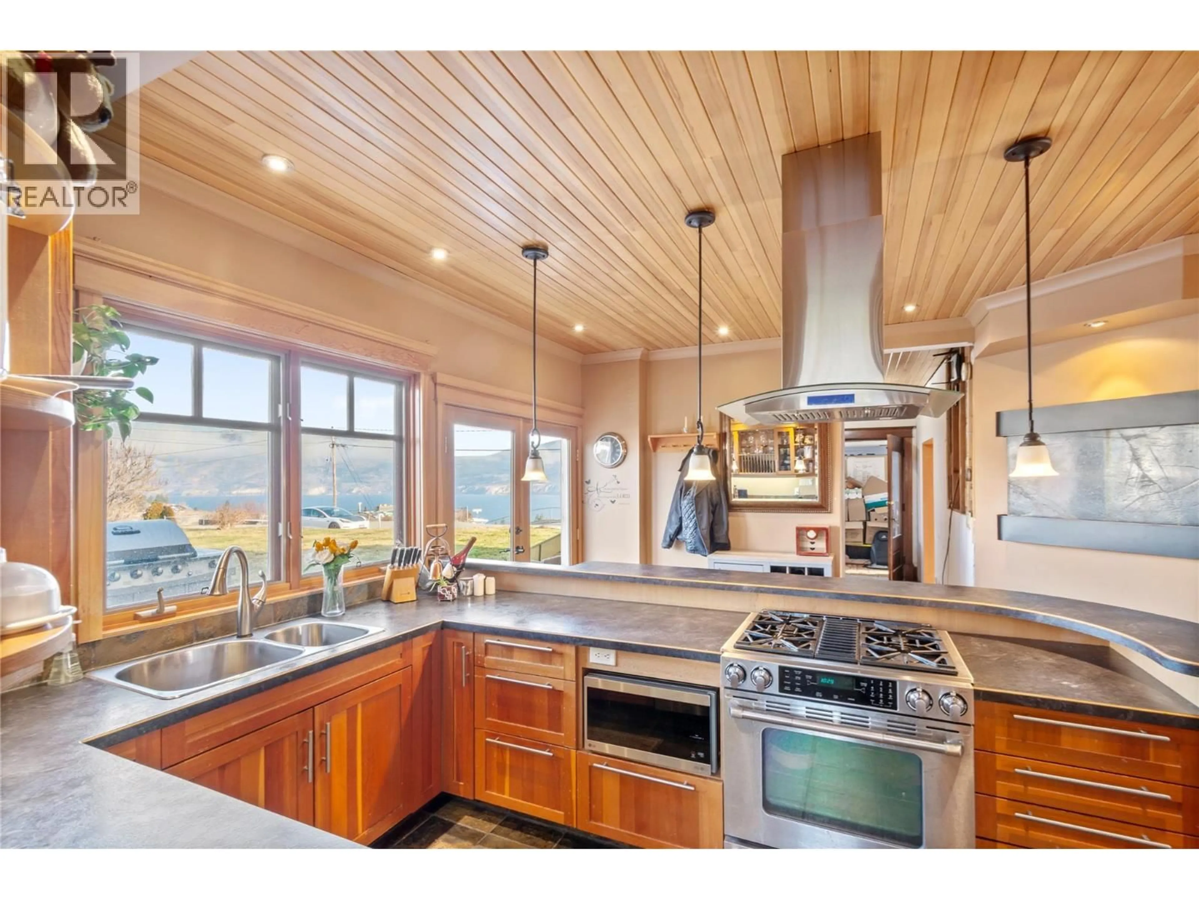 Open concept kitchen, wood/laminate floor for 13606 COOKE AVENUE, Summerland British Columbia V0H1Z1