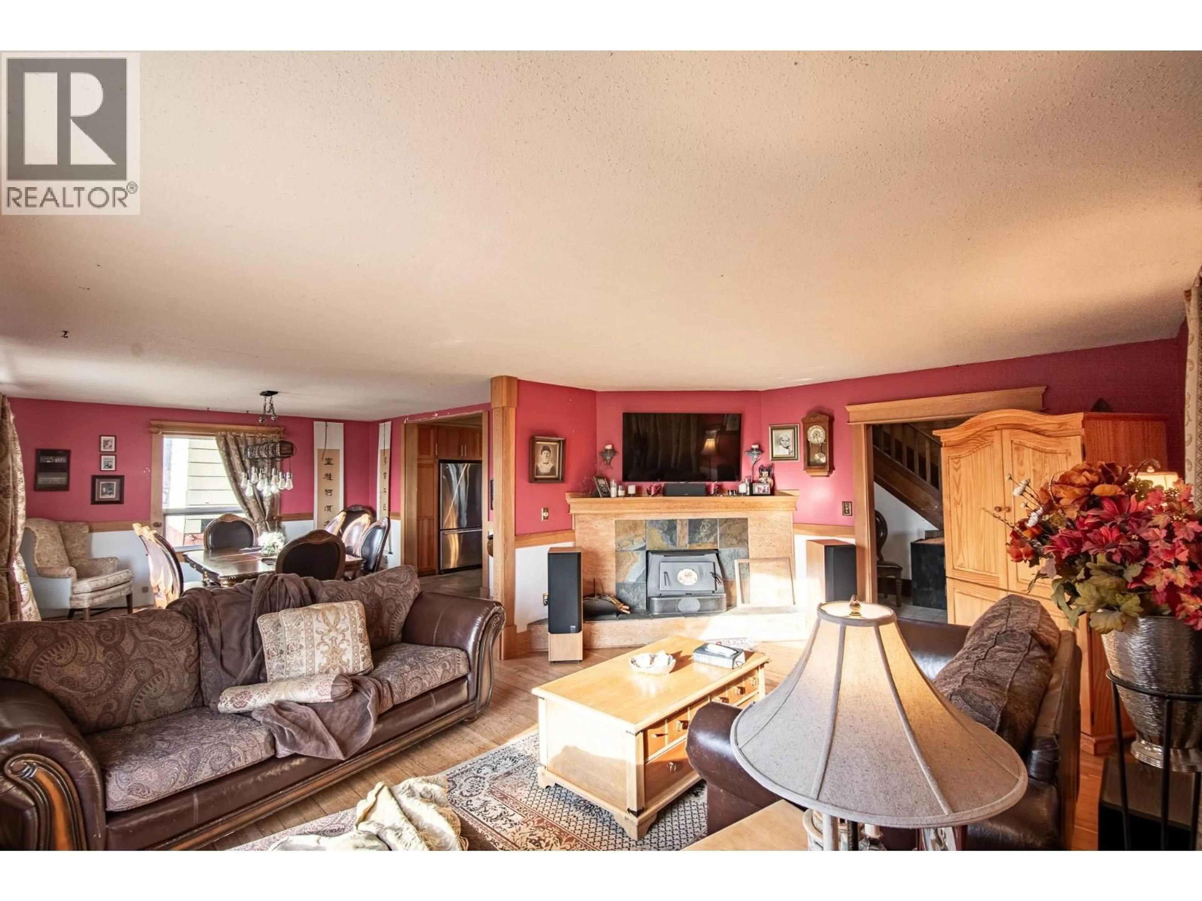 Living room with furniture, wood/laminate floor for 13606 COOKE AVENUE, Summerland British Columbia V0H1Z1