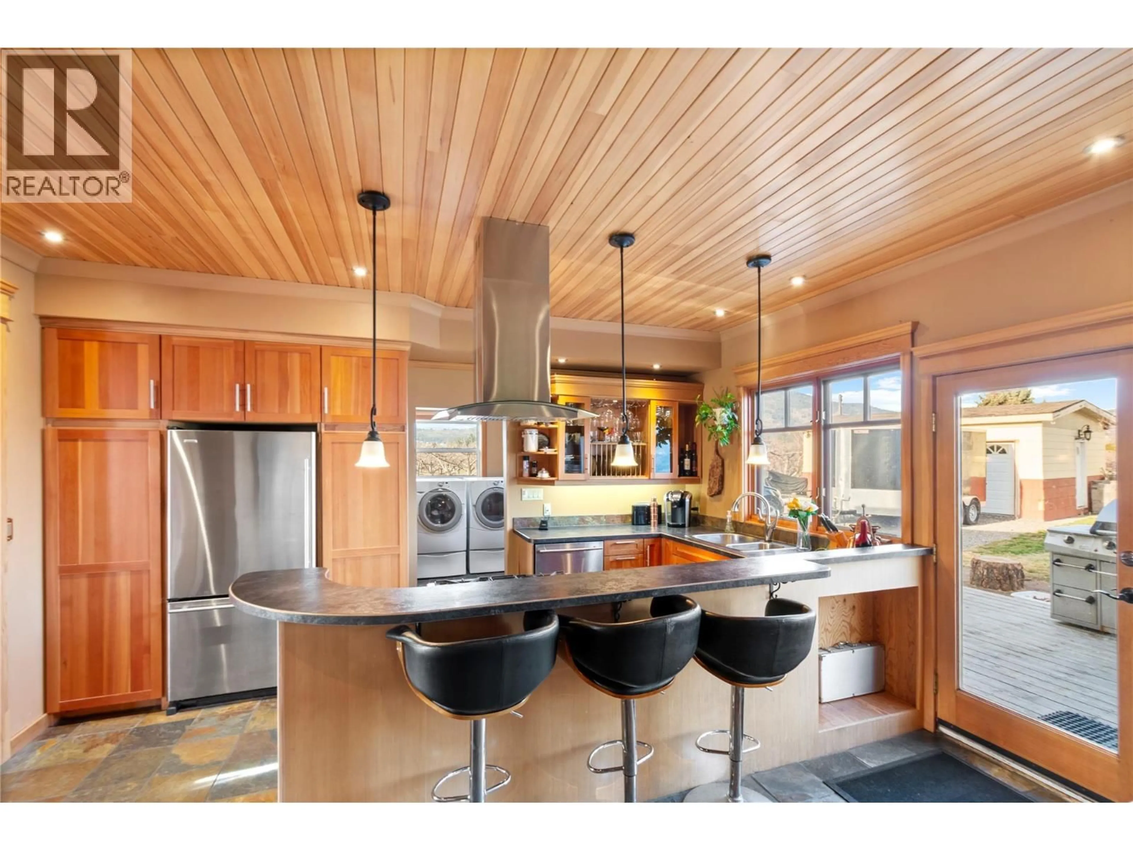 Open concept kitchen, wood/laminate floor for 13606 COOKE AVENUE, Summerland British Columbia V0H1Z1