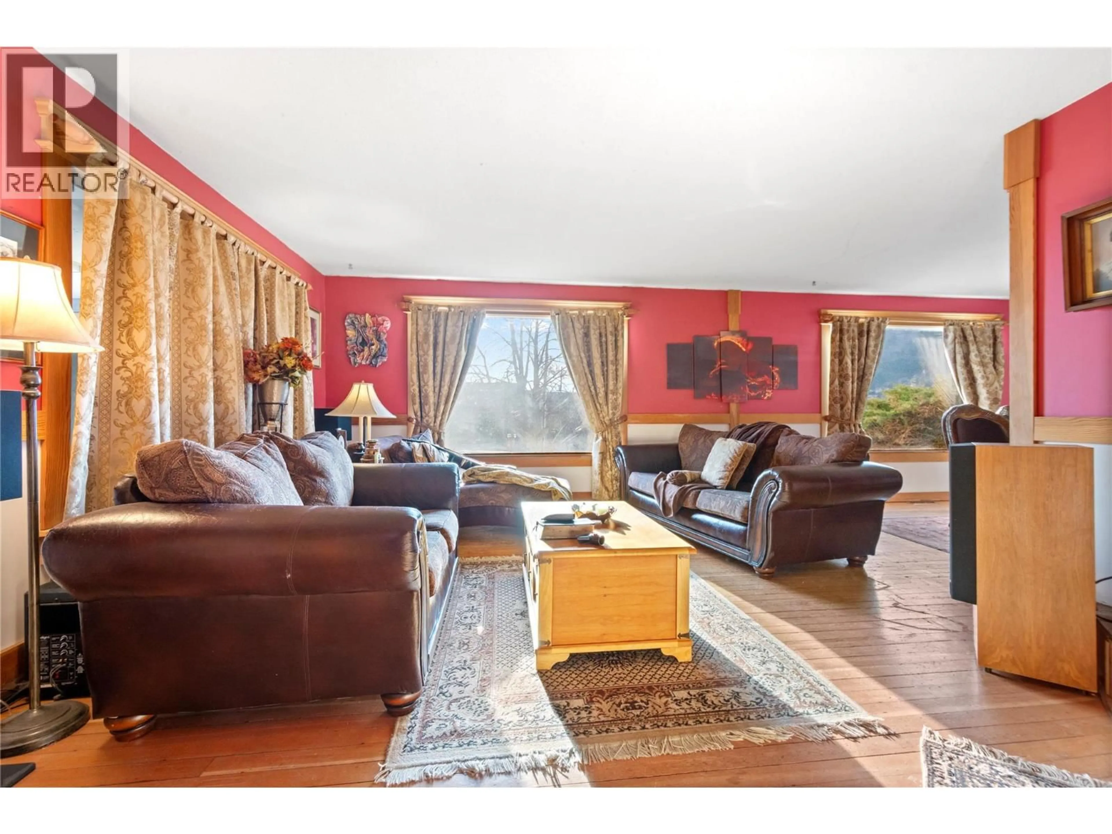 Living room with furniture, wood/laminate floor for 13606 COOKE AVENUE, Summerland British Columbia V0H1Z1