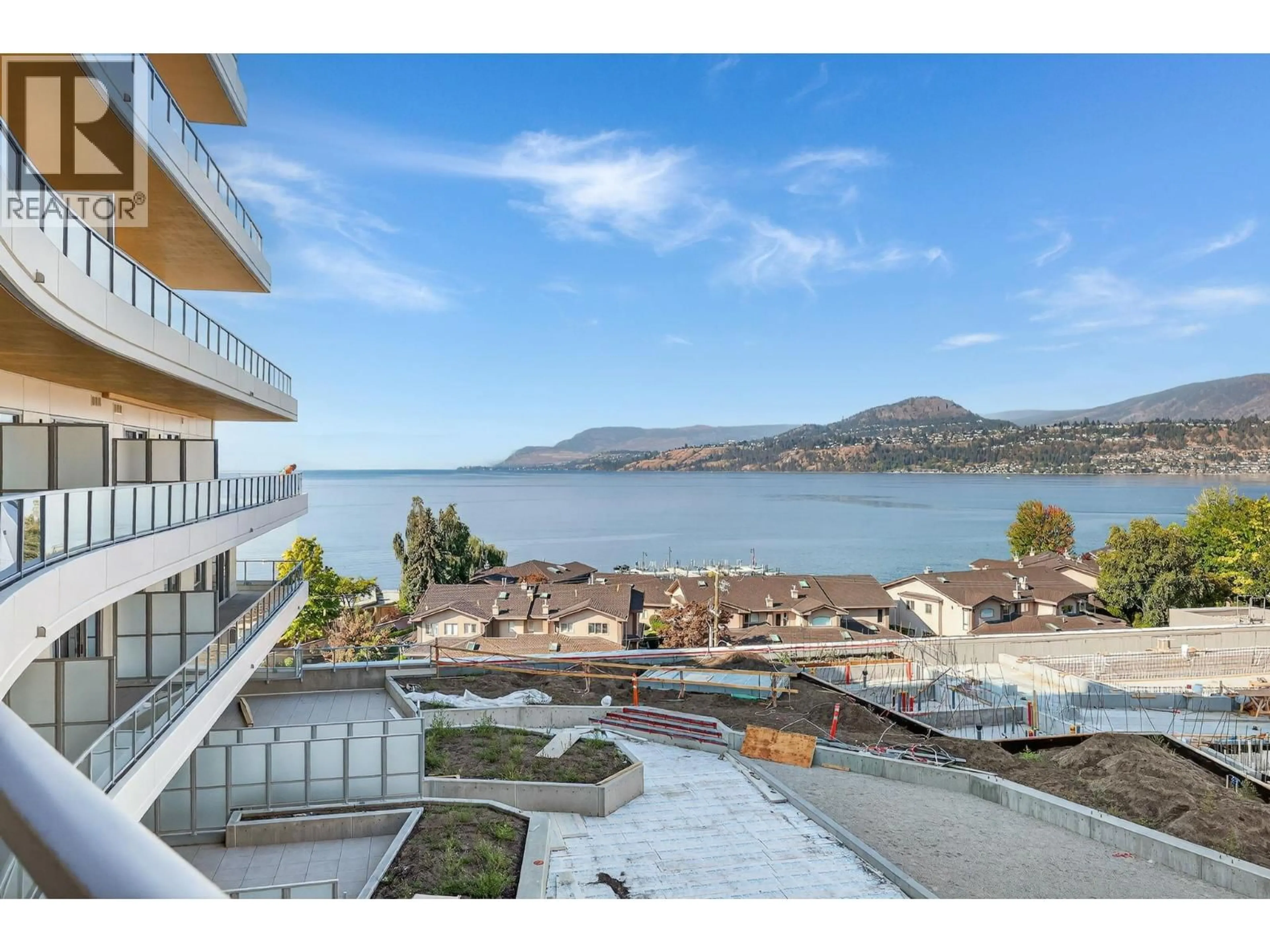 A pic from outside/outdoor area/front of a property/back of a property/a pic from drone, water/lake/river/ocean view for 1006 - 3340 LAKESHORE ROAD, Kelowna British Columbia V1W3S9