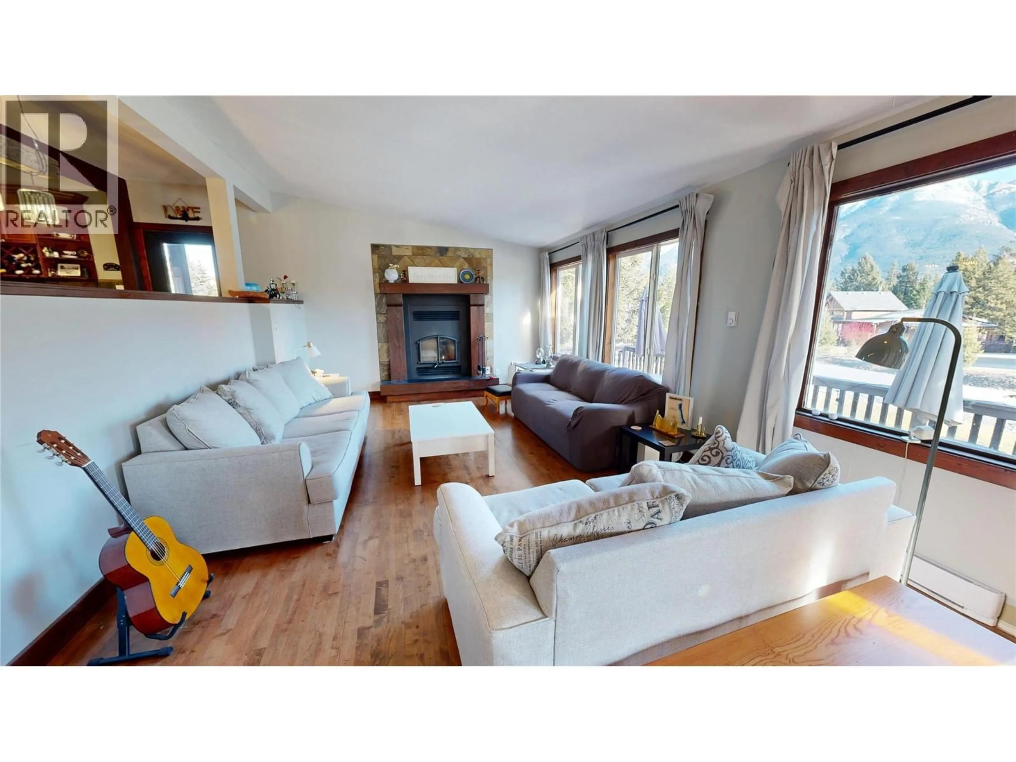 Living room with furniture, wood/laminate floor for 6891 COLUMBIA RIDGE DRIVE, Fairmont Hot Springs British Columbia V0B1L2