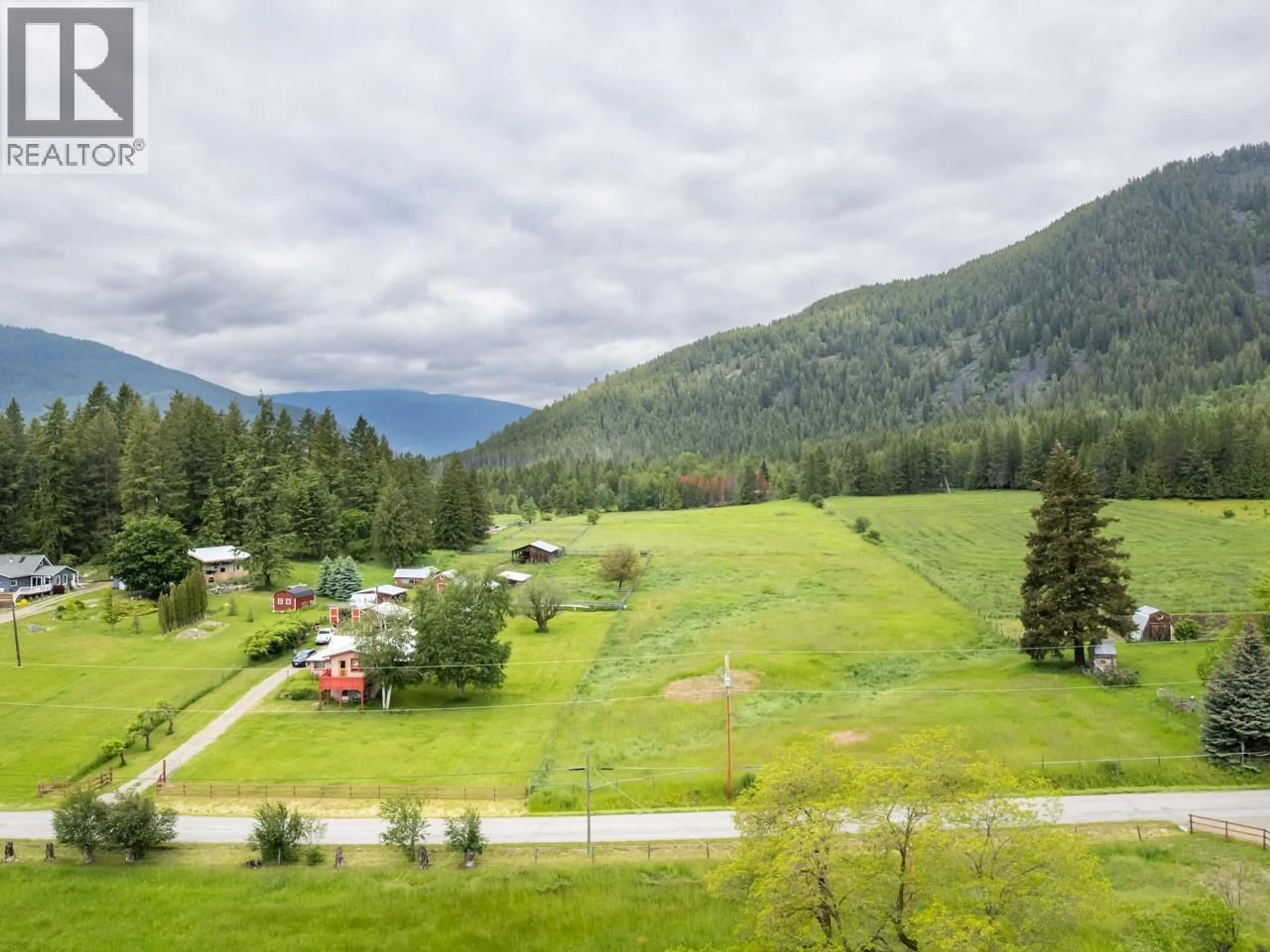 A pic from outside/outdoor area/front of a property/back of a property/a pic from drone, mountain view for 4512 48TH STREET, Canyon British Columbia V0B1C1