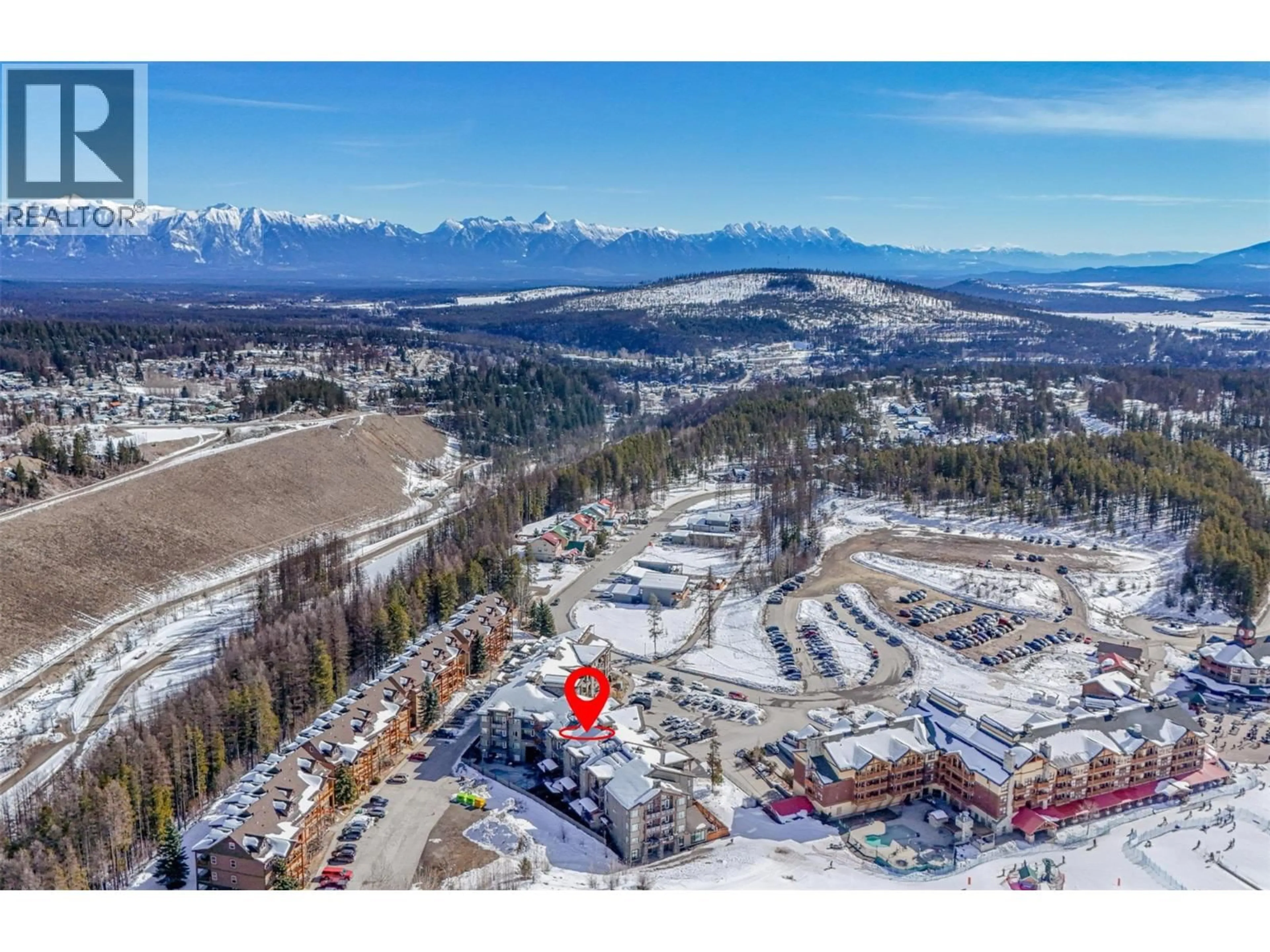 A pic from outside/outdoor area/front of a property/back of a property/a pic from drone, mountain view for 419 - 400 STEMWINDER DRIVE, Kimberley British Columbia V1A2Y9