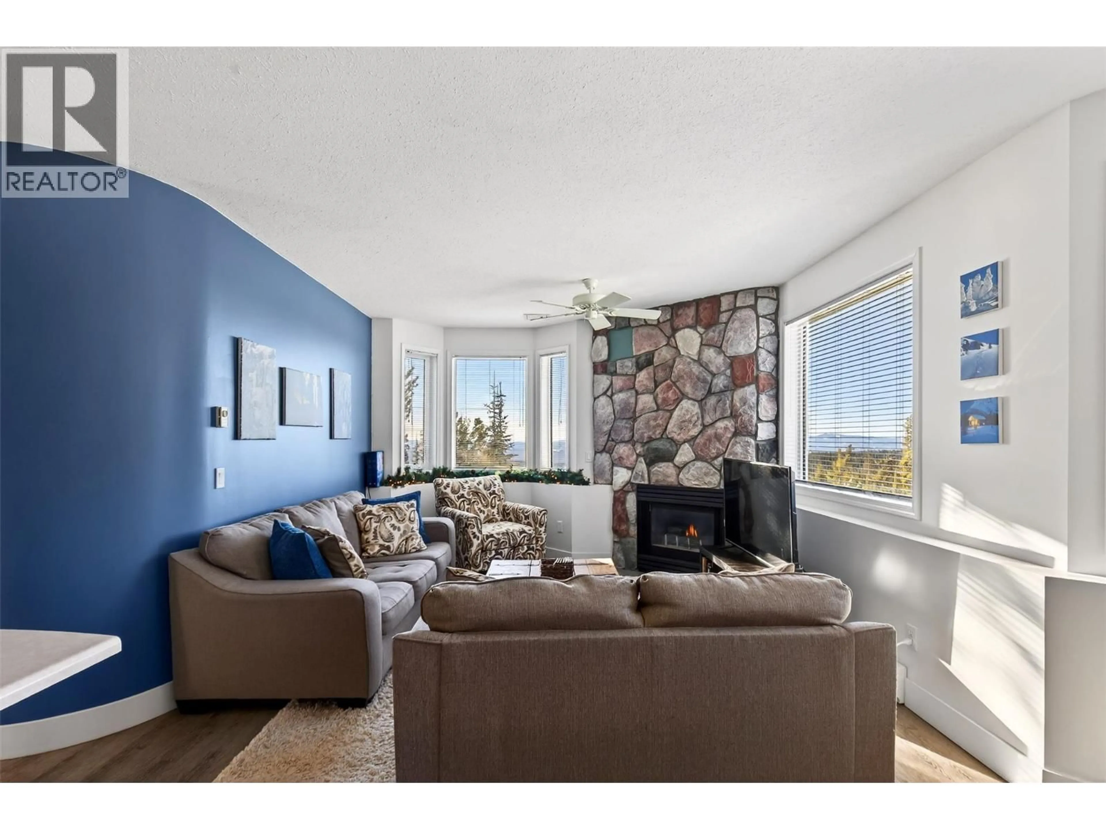 Living room with furniture, ceramic/tile floor for 104 - 225 KETTLE VIEW ROAD, Big White British Columbia V1P1P3