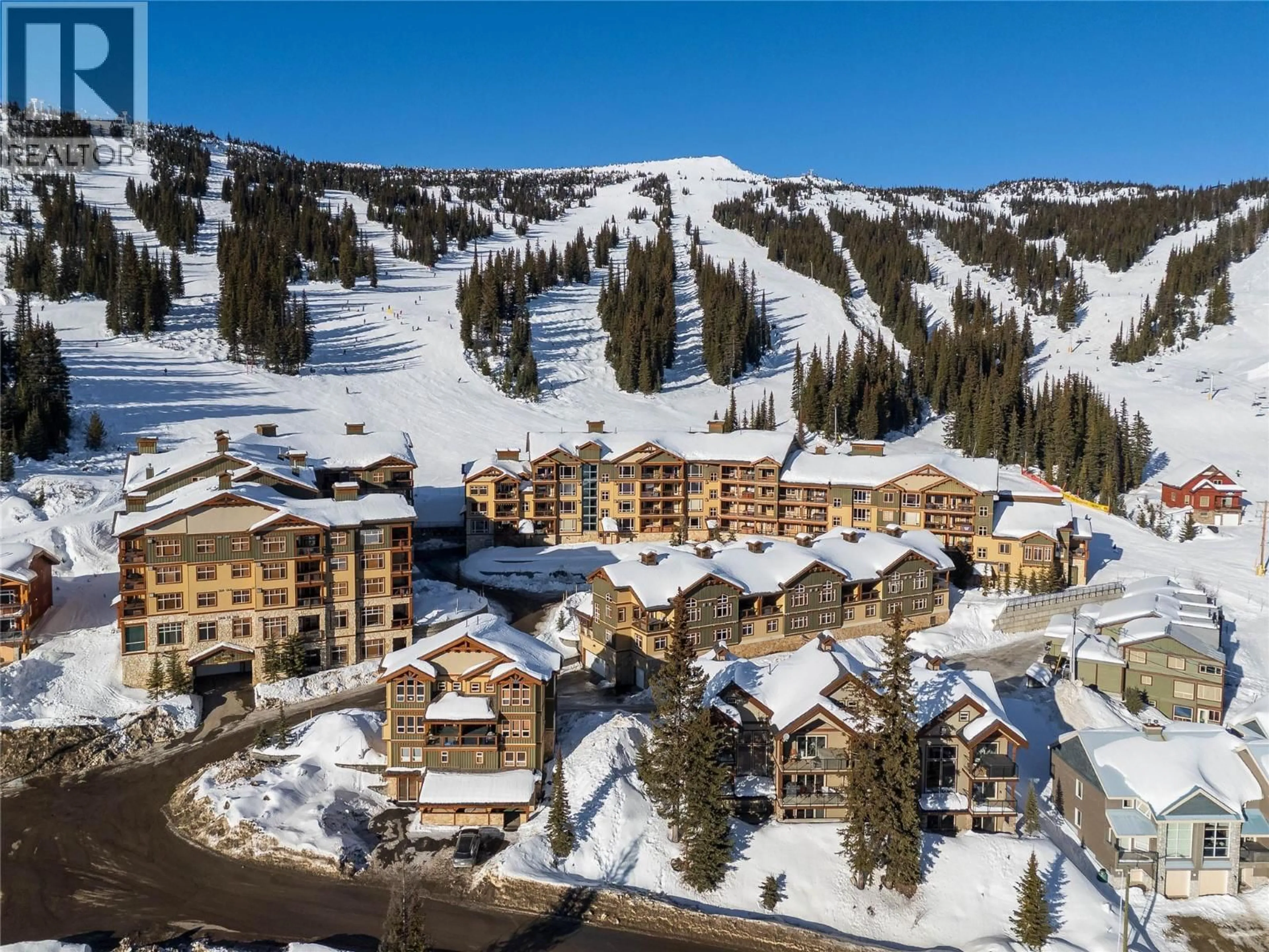 A pic from outside/outdoor area/front of a property/back of a property/a pic from drone, mountain view for 401 - 7700 PORCUPINE ROAD, Big White British Columbia V1P1P3