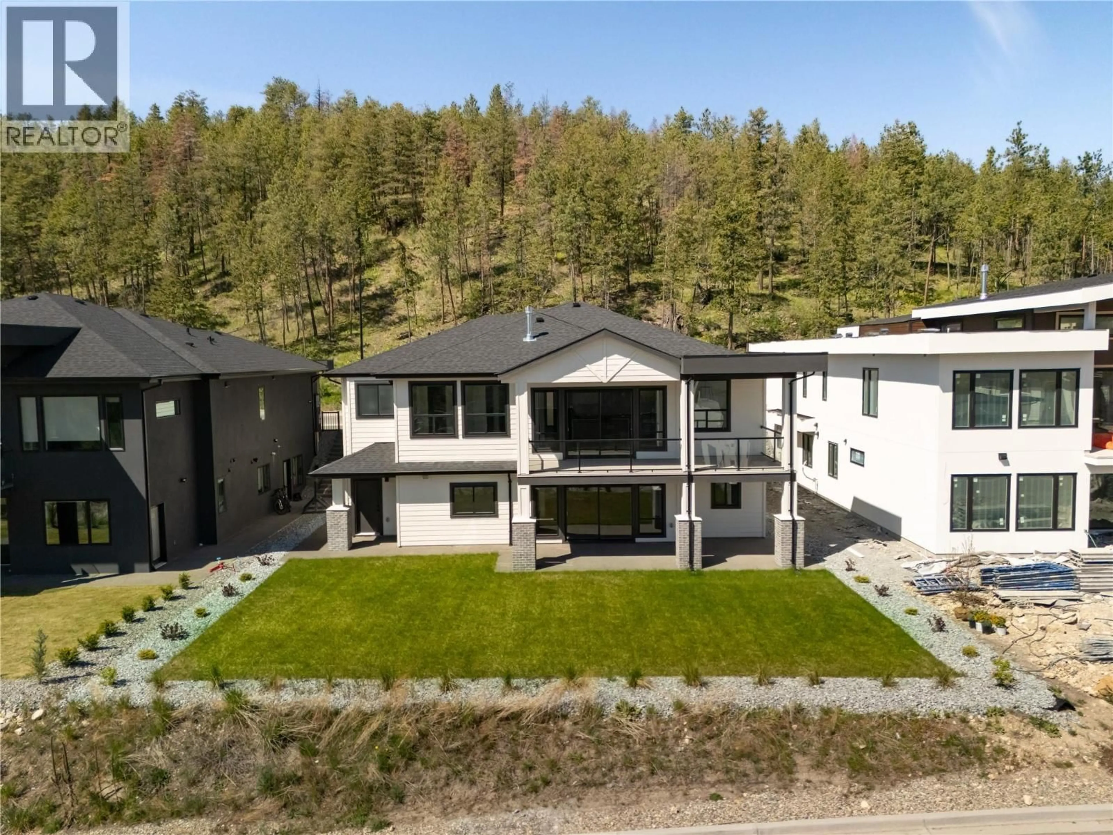 A pic from outside/outdoor area/front of a property/back of a property/a pic from drone, mountain view for 893 LOSETH DRIVE, Kelowna British Columbia V1P0A8