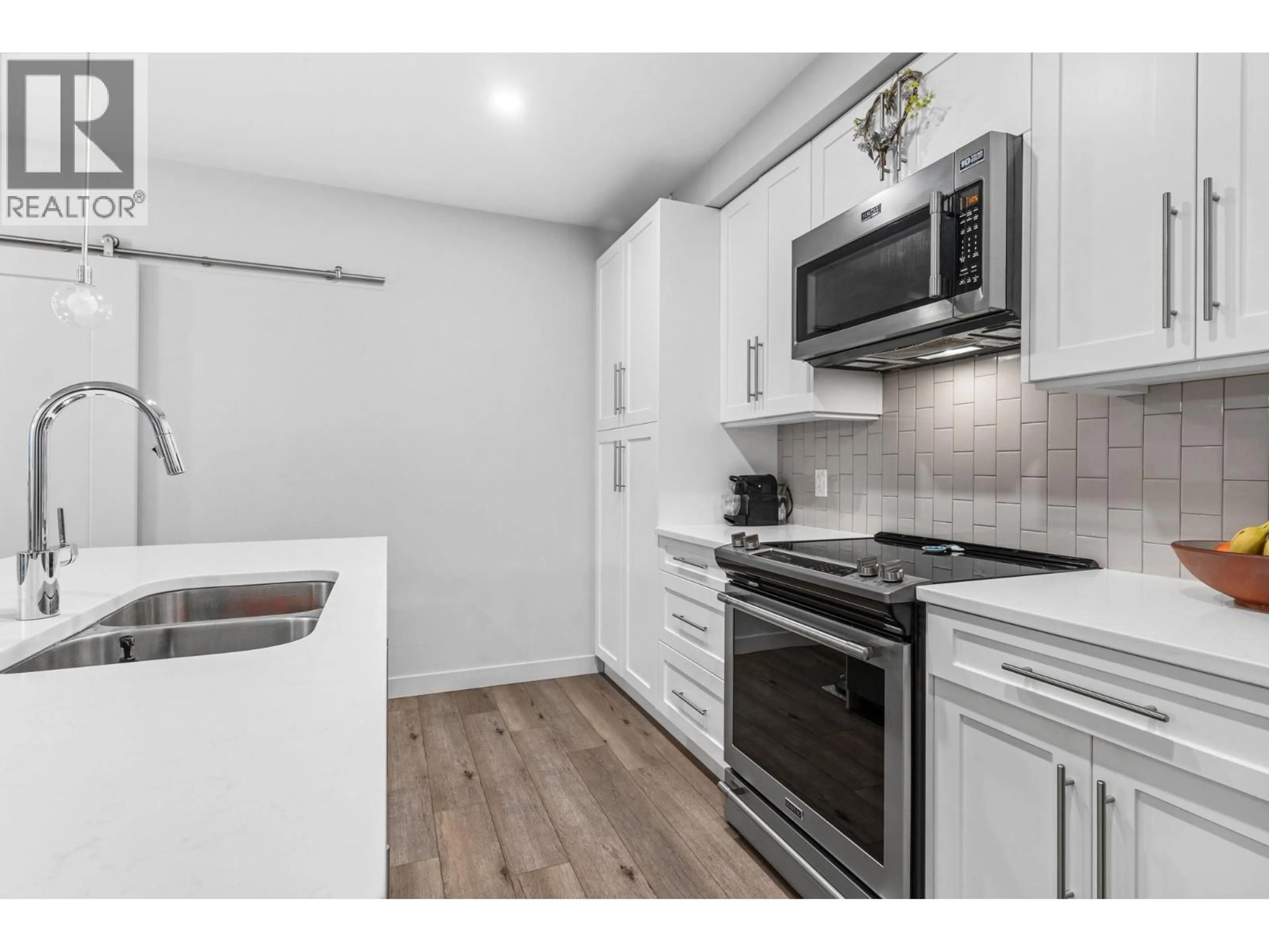 Standard kitchen, wood/laminate floor for 106 - 3630 MISSION SPRINGS DRIVE, Kelowna British Columbia V1W0B2