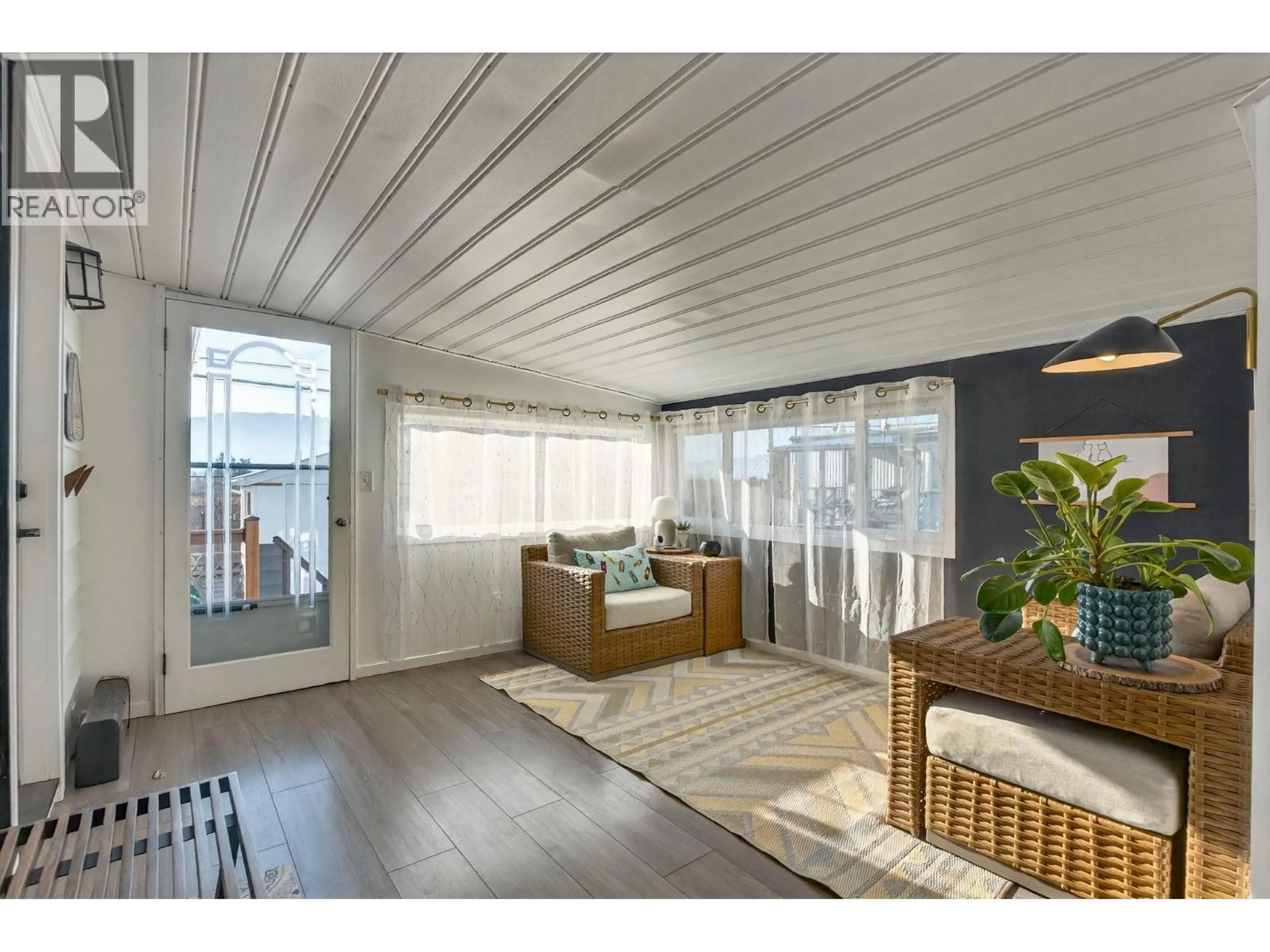 Living room with furniture, wood/laminate floor for 137 - 1880 OLD BOUCHERIE ROAD, West Kelowna British Columbia V4T1Z3