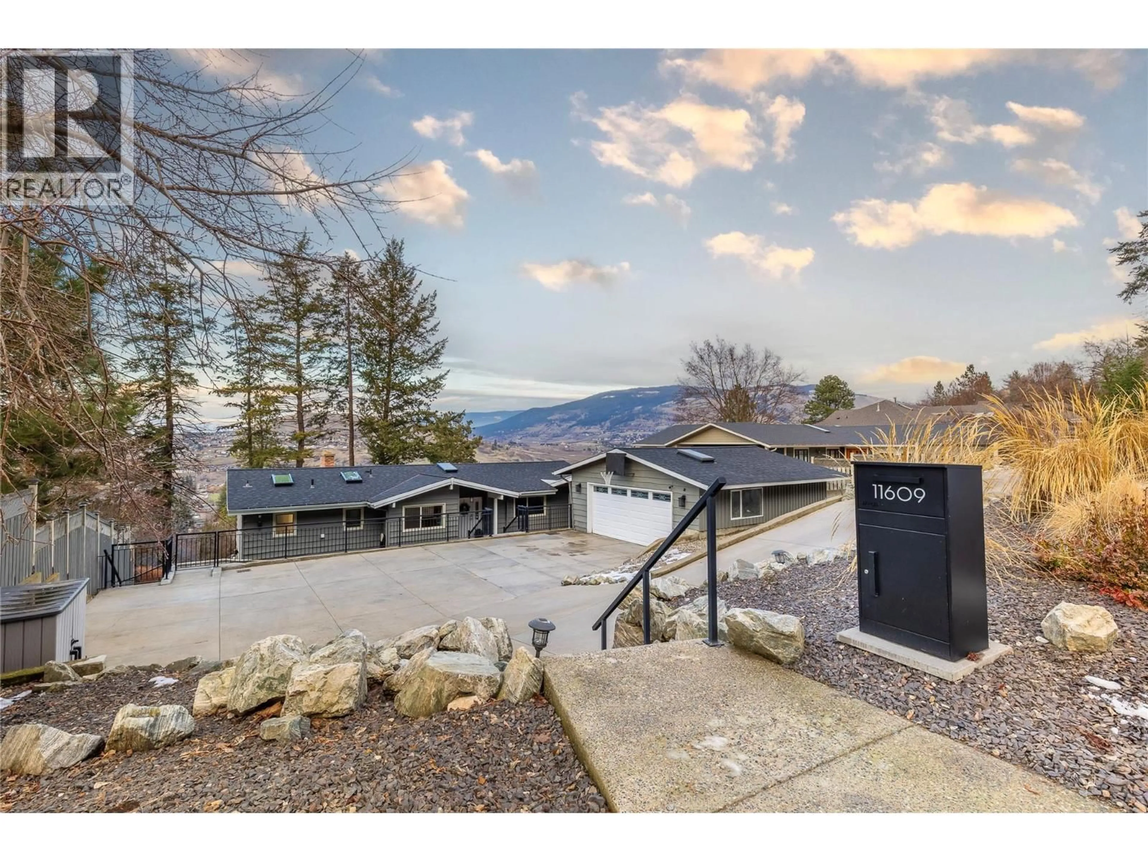 A pic from outside/outdoor area/front of a property/back of a property/a pic from drone, mountain view for 11609 UPPER SUMMIT DRIVE, Coldstream British Columbia V1B2B5