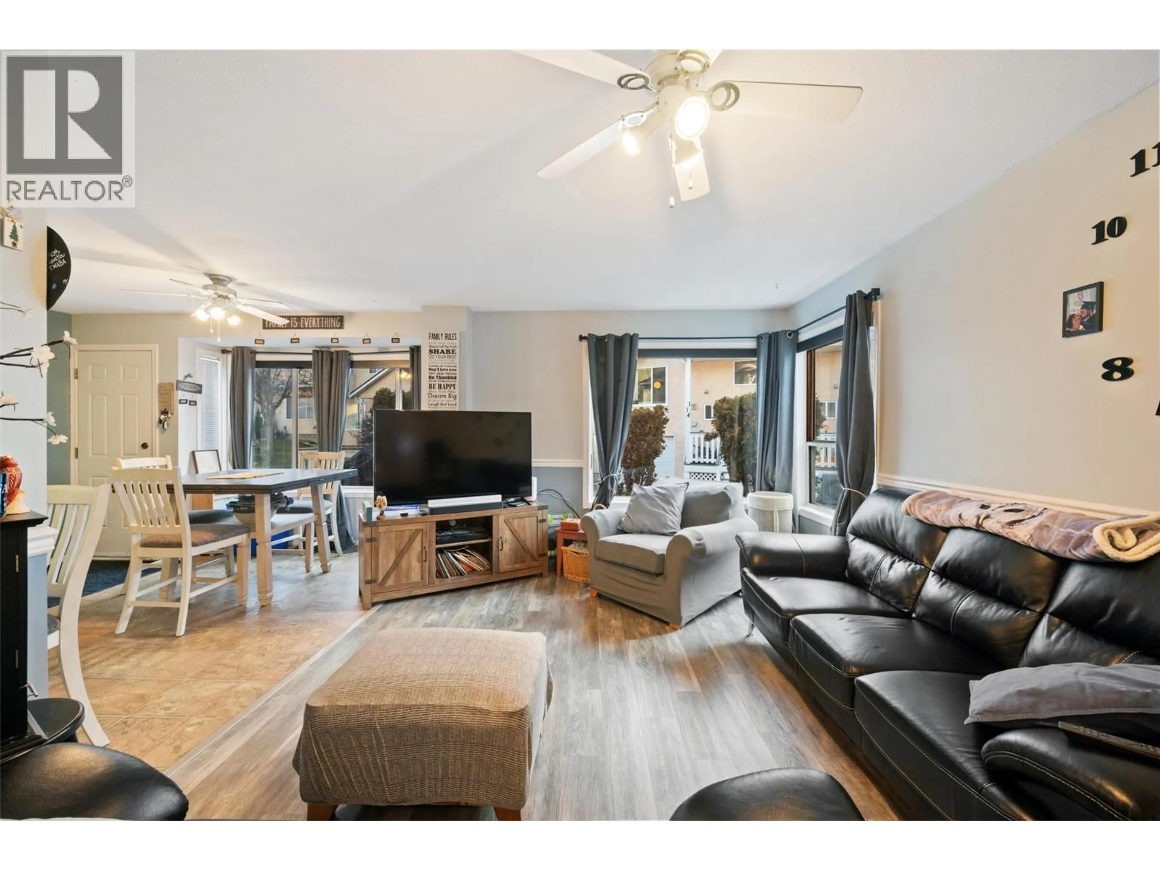 Living room with furniture, wood/laminate floor for 118 - 1458 PENTICTON AVENUE, Penticton British Columbia V2A8L3