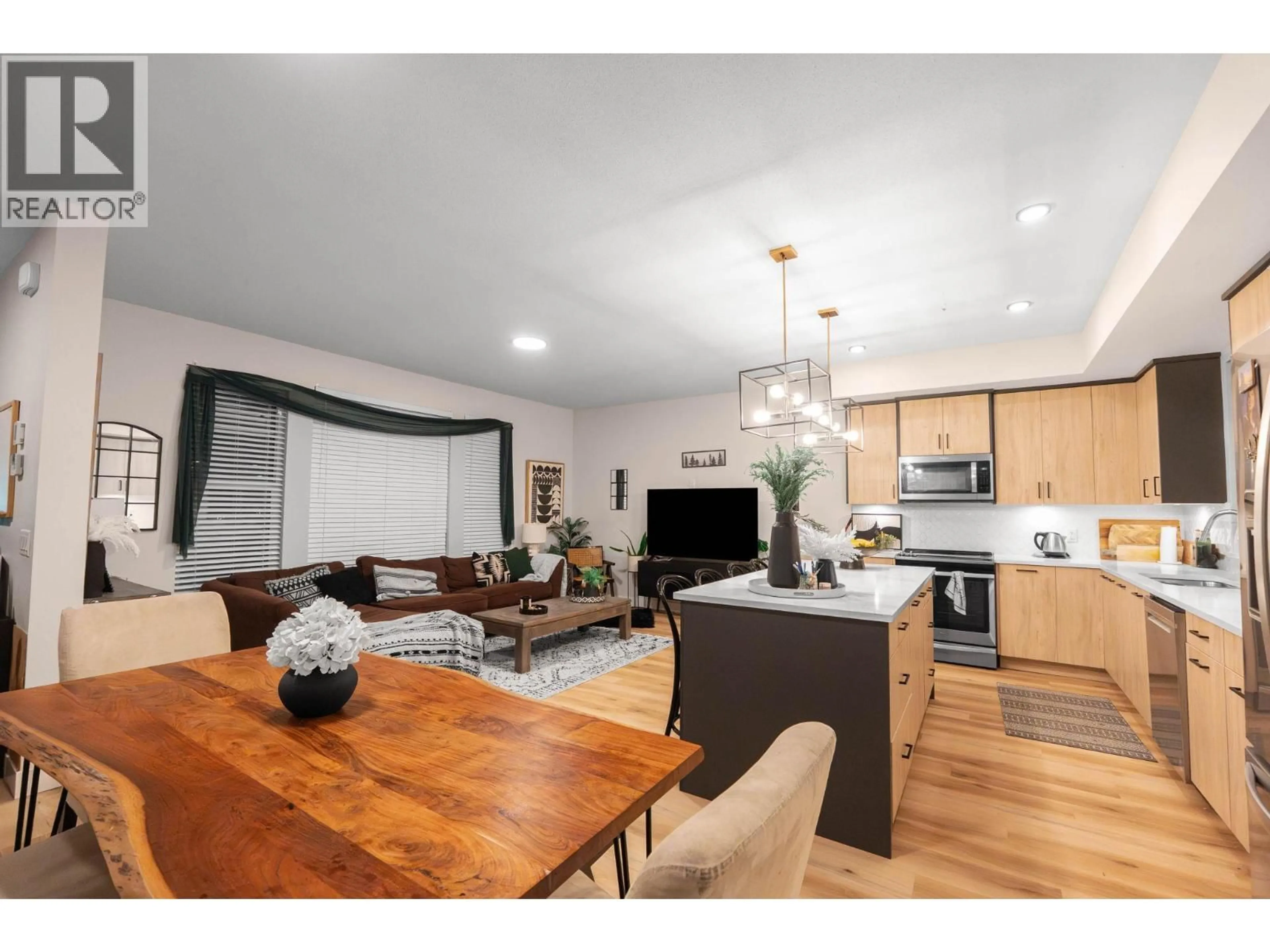 Open concept kitchen, wood/laminate floor for 126 - 4025 GELLATLY ROAD SOUTH, West Kelowna British Columbia V4T0E6