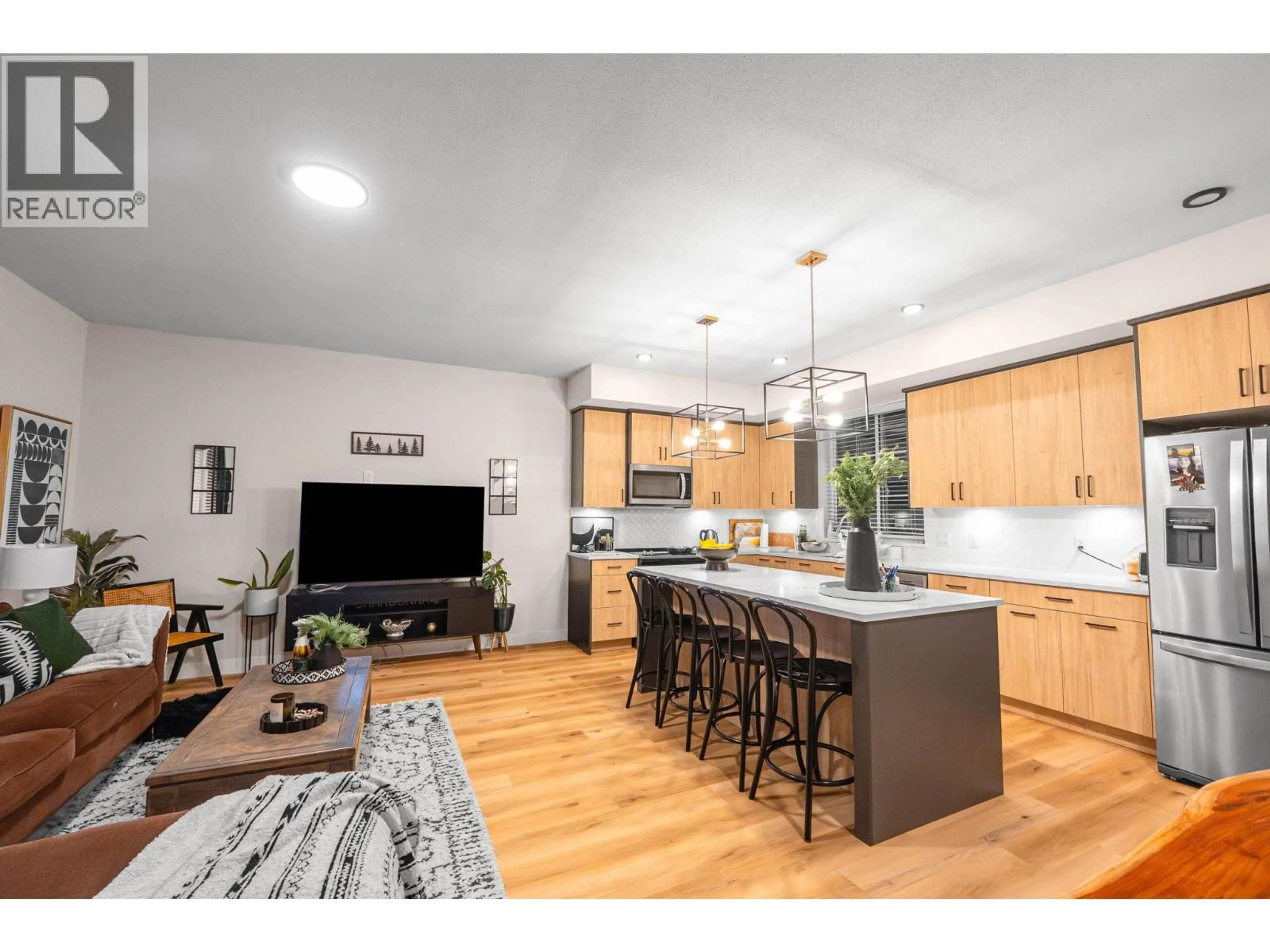 Open concept kitchen, wood/laminate floor for 126 - 4025 GELLATLY ROAD SOUTH, West Kelowna British Columbia V4T0E6