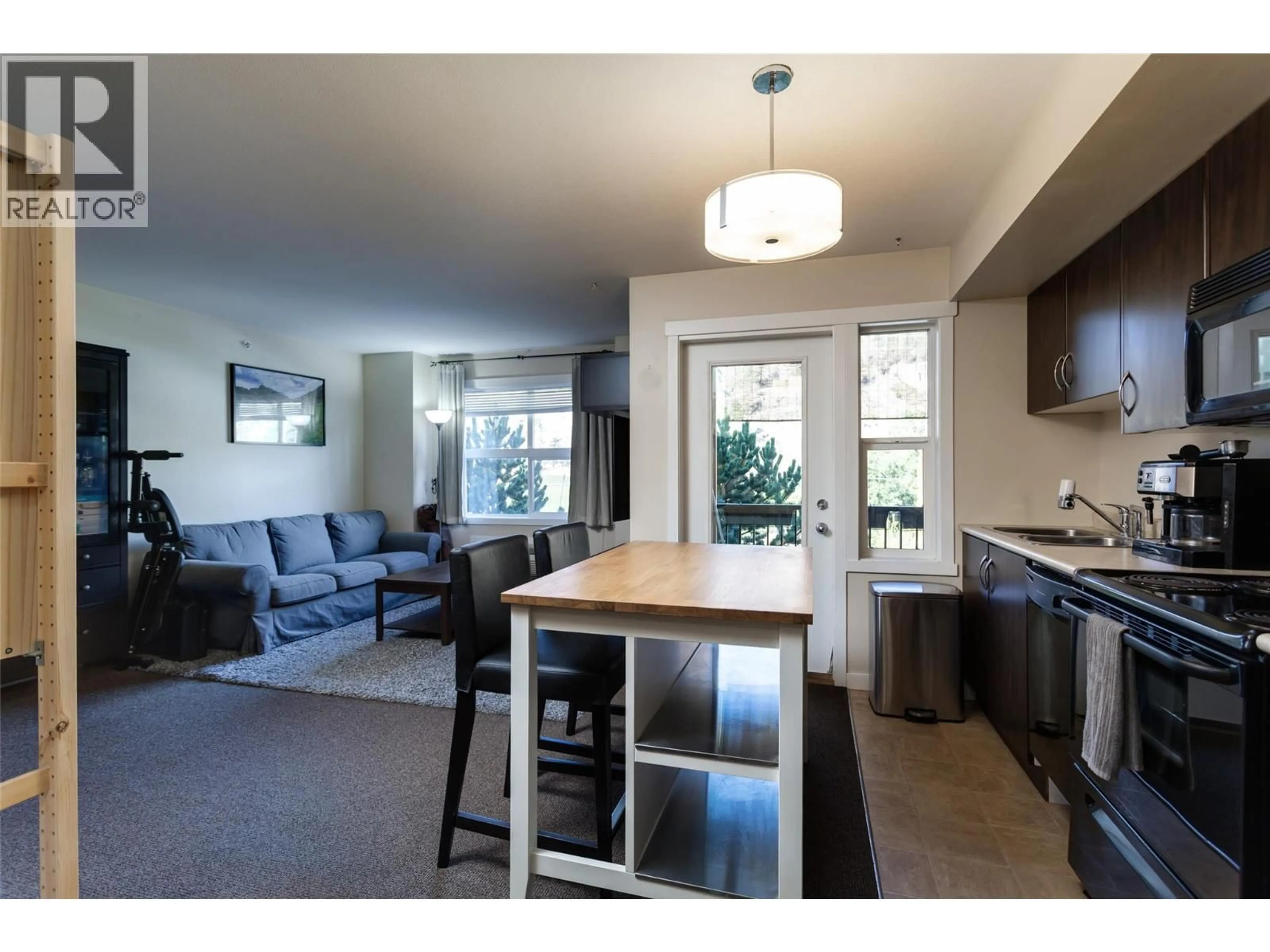 Open concept kitchen, wood/laminate floor for 205A - 1475 GLENMORE ROAD NORTH, Kelowna British Columbia V1V2C5