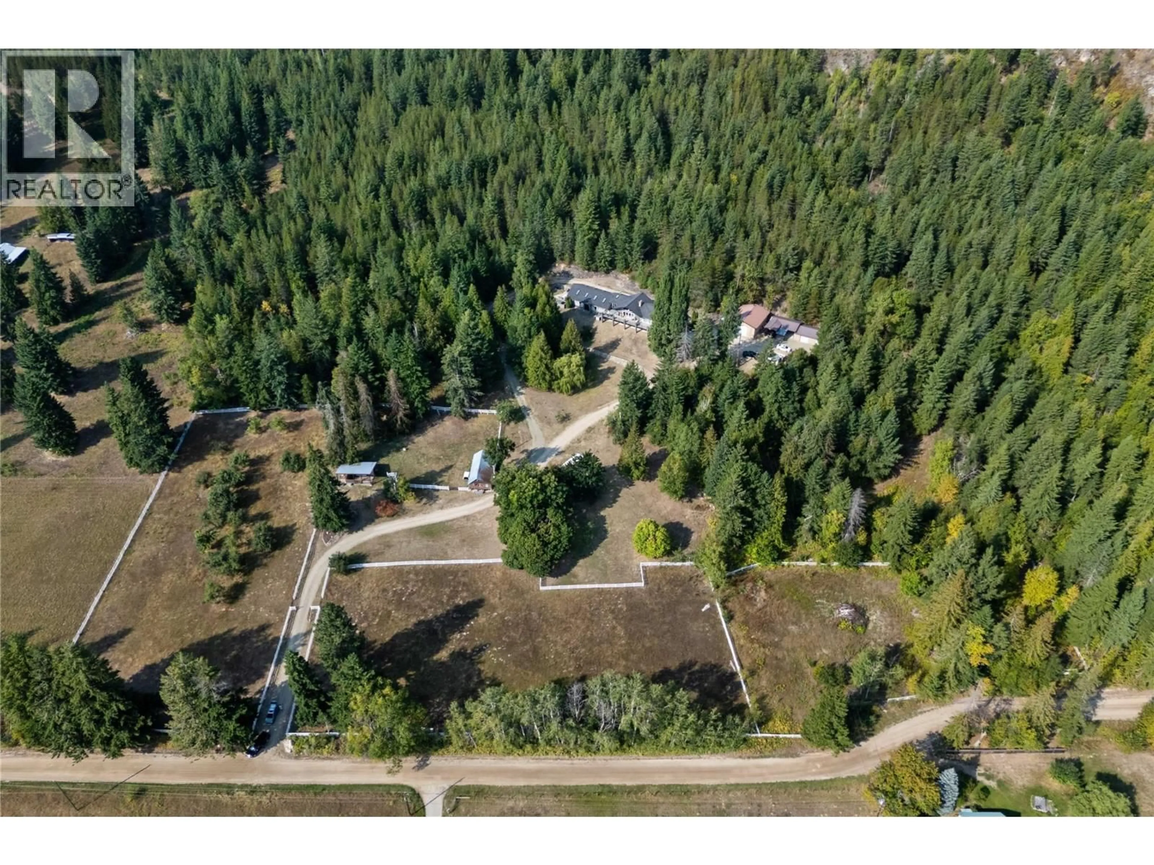 A pic from outside/outdoor area/front of a property/back of a property/a pic from drone, forest/trees view for 6171 50 STREET NORTHWEST, Salmon Arm British Columbia V1E3A6