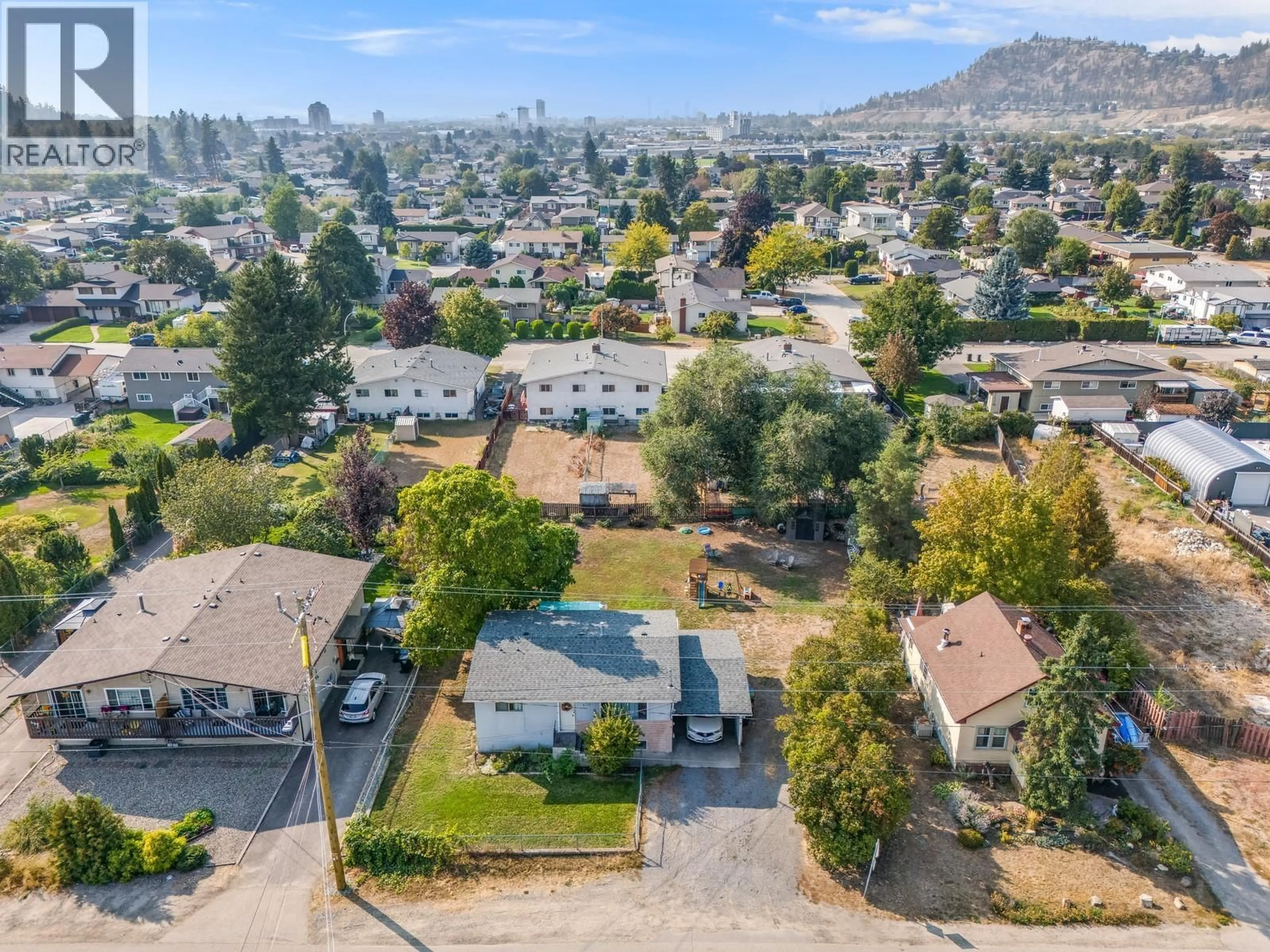 A pic from outside/outdoor area/front of a property/back of a property/a pic from drone, mountain view for 470 GERSTMAR ROAD, Kelowna British Columbia V1X4B1