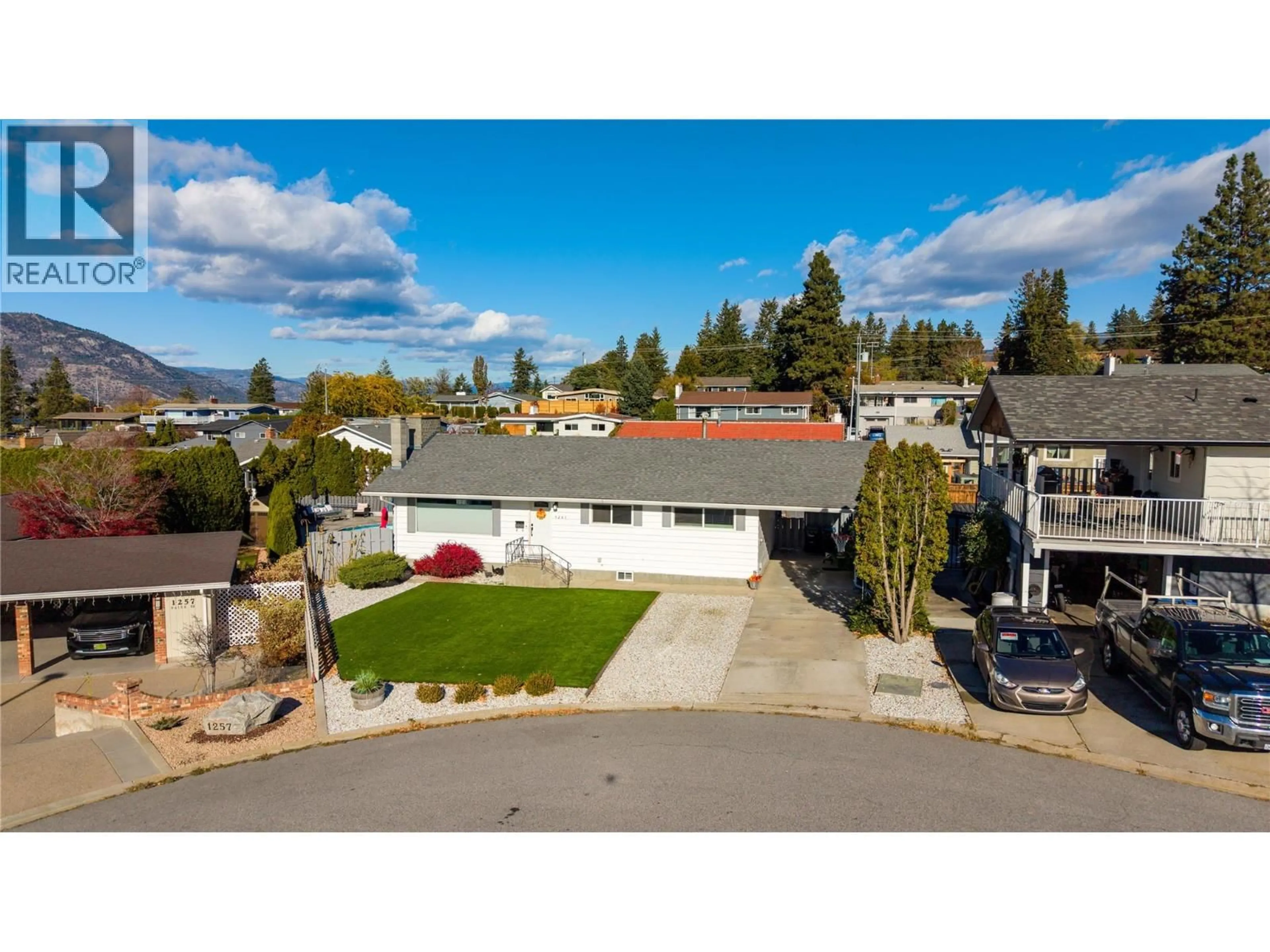 A pic from outside/outdoor area/front of a property/back of a property/a pic from drone, mountain view for 1261 NAISH DRIVE, Penticton British Columbia V2A3B4