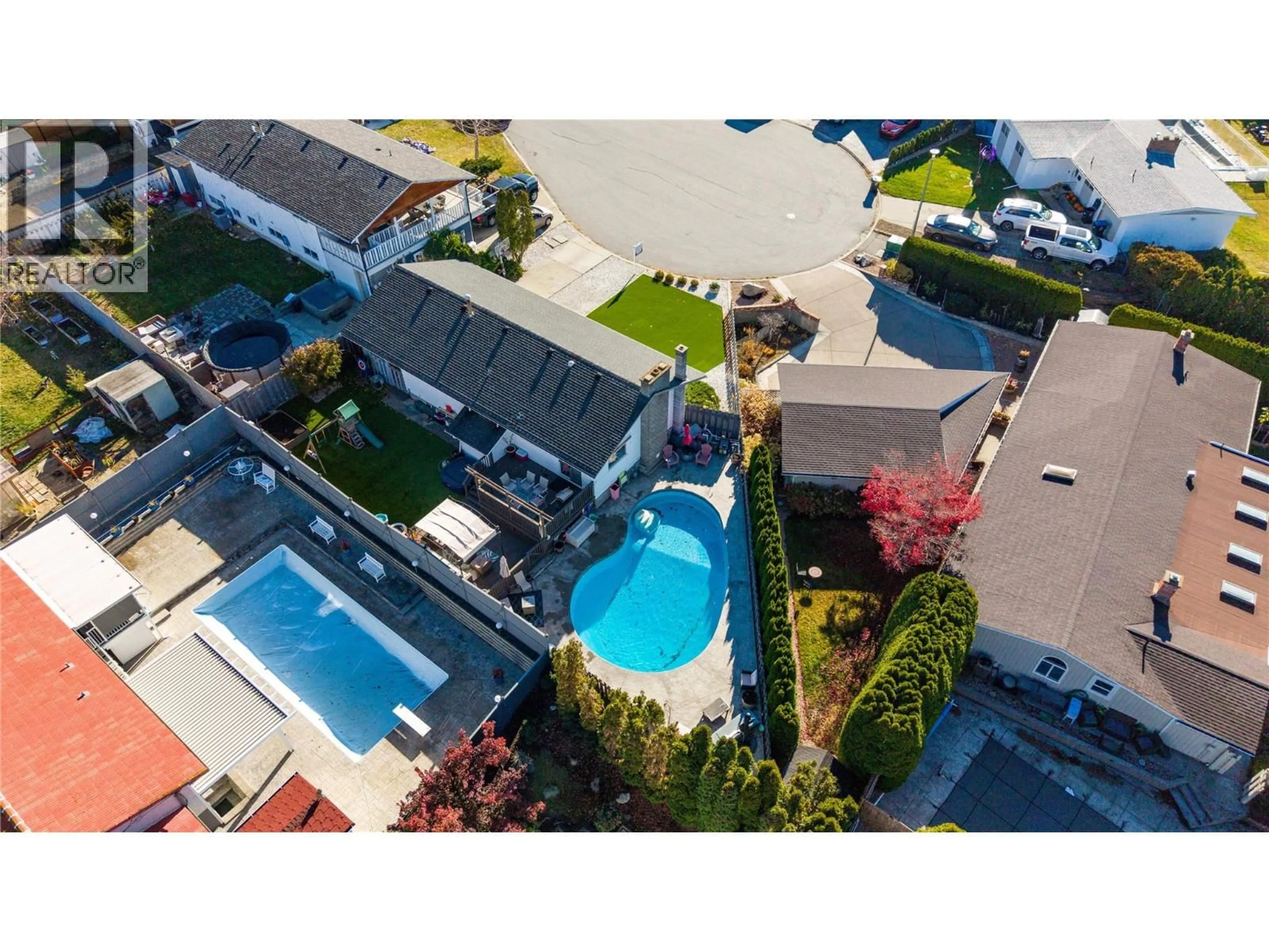A pic from outside/outdoor area/front of a property/back of a property/a pic from drone, street for 1261 NAISH DRIVE, Penticton British Columbia V2A3B4