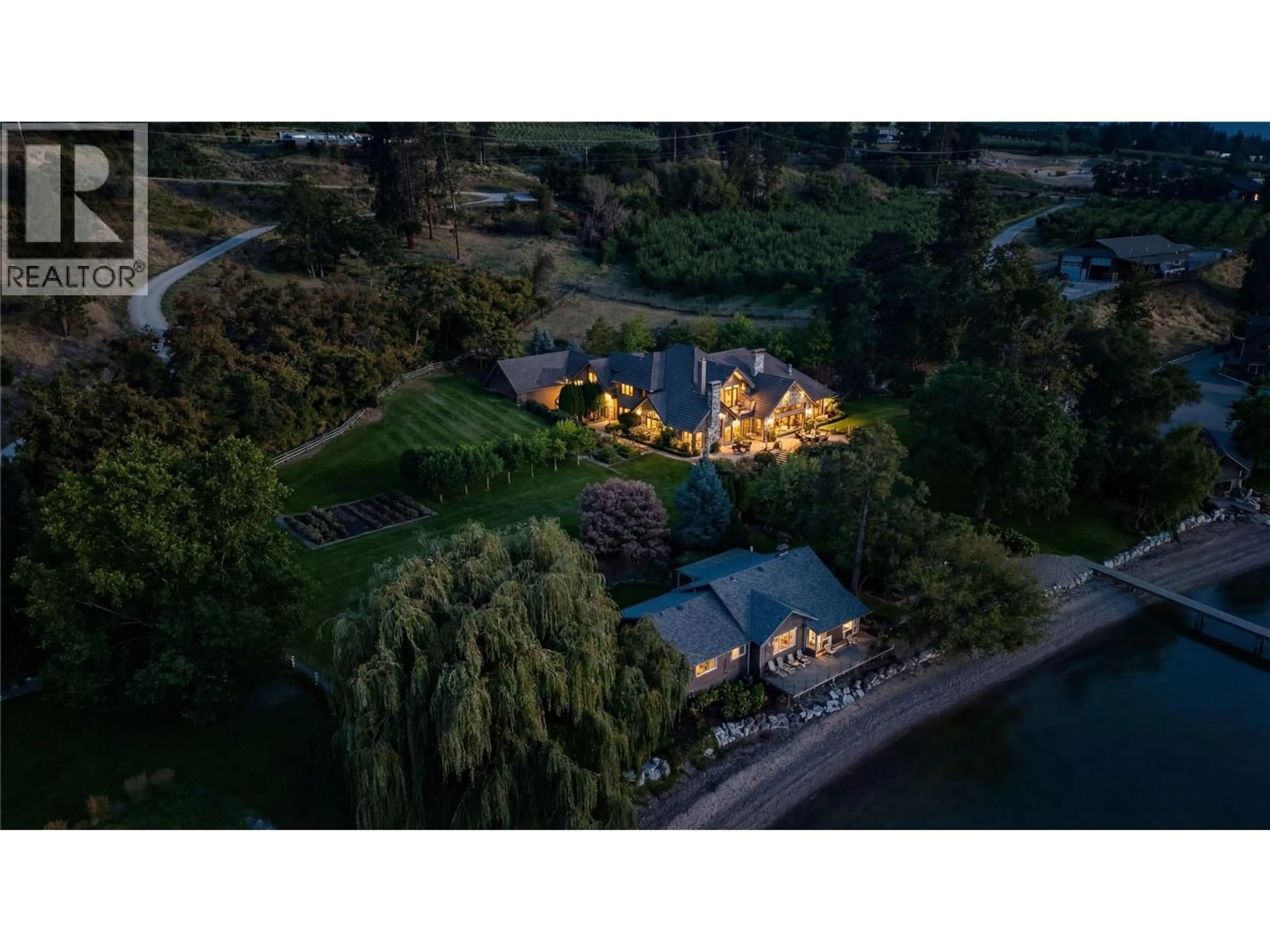 A pic from outside/outdoor area/front of a property/back of a property/a pic from drone, water/lake/river/ocean view for 12056 OKANAGAN CENTRE ROAD WEST, Lake Country British Columbia V4V2H5