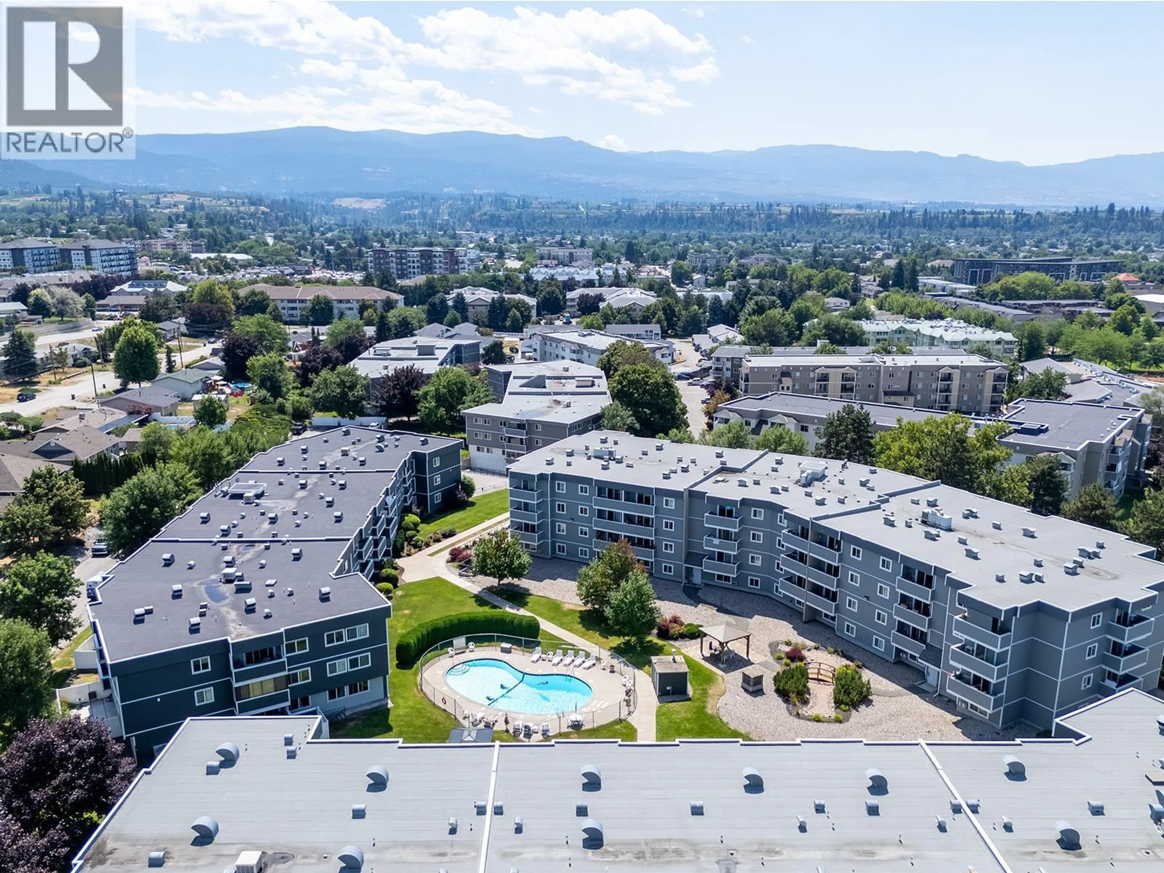 A pic from outside/outdoor area/front of a property/back of a property/a pic from drone, mountain view for 329 - 495 ALL STAR COURT, Kelowna British Columbia V1X5N7