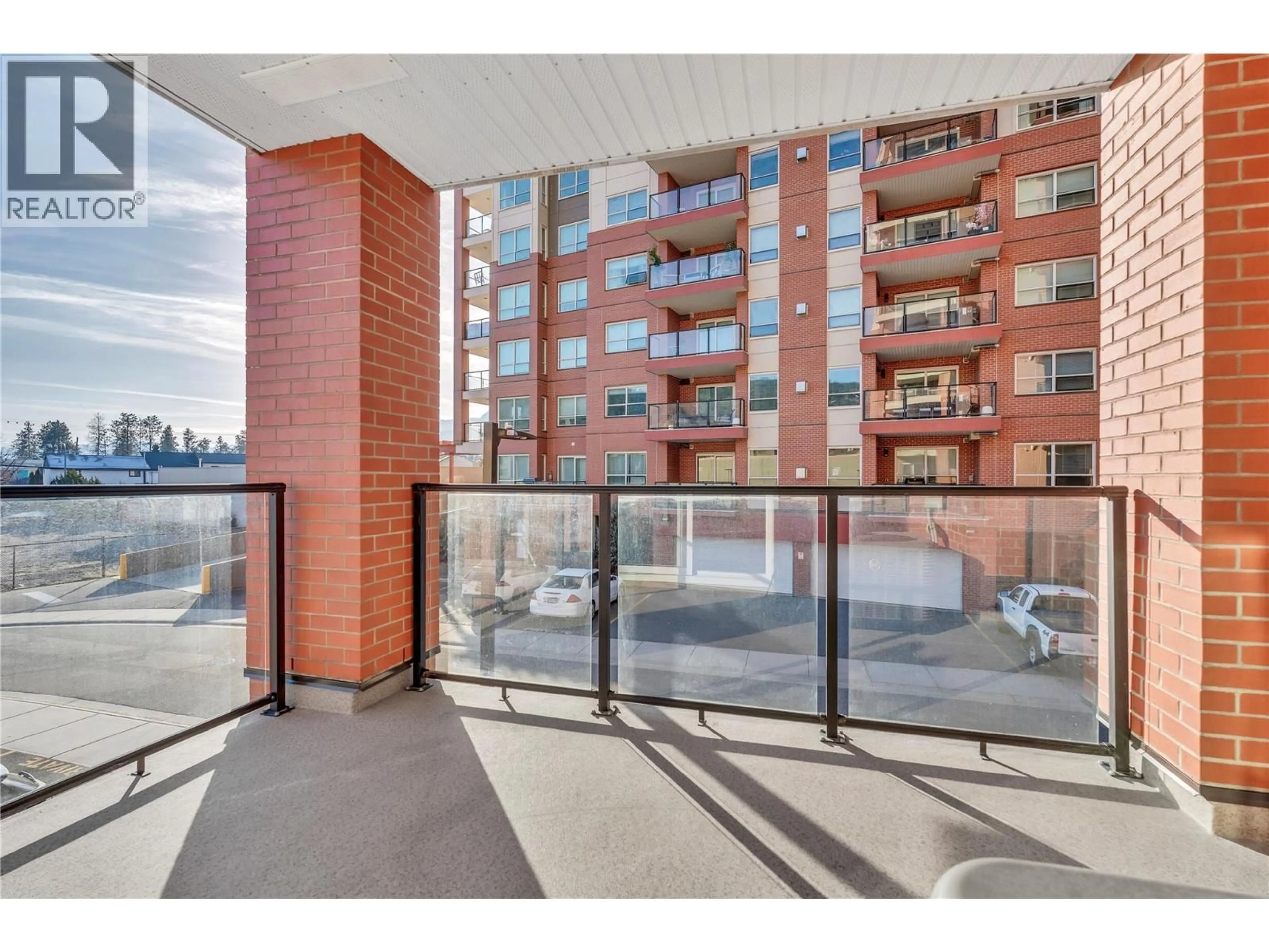 Balcony in the apartment, city buildings view from balcony for 203 - 3362 SKAHA LAKE ROAD, Penticton British Columbia V2A6G4