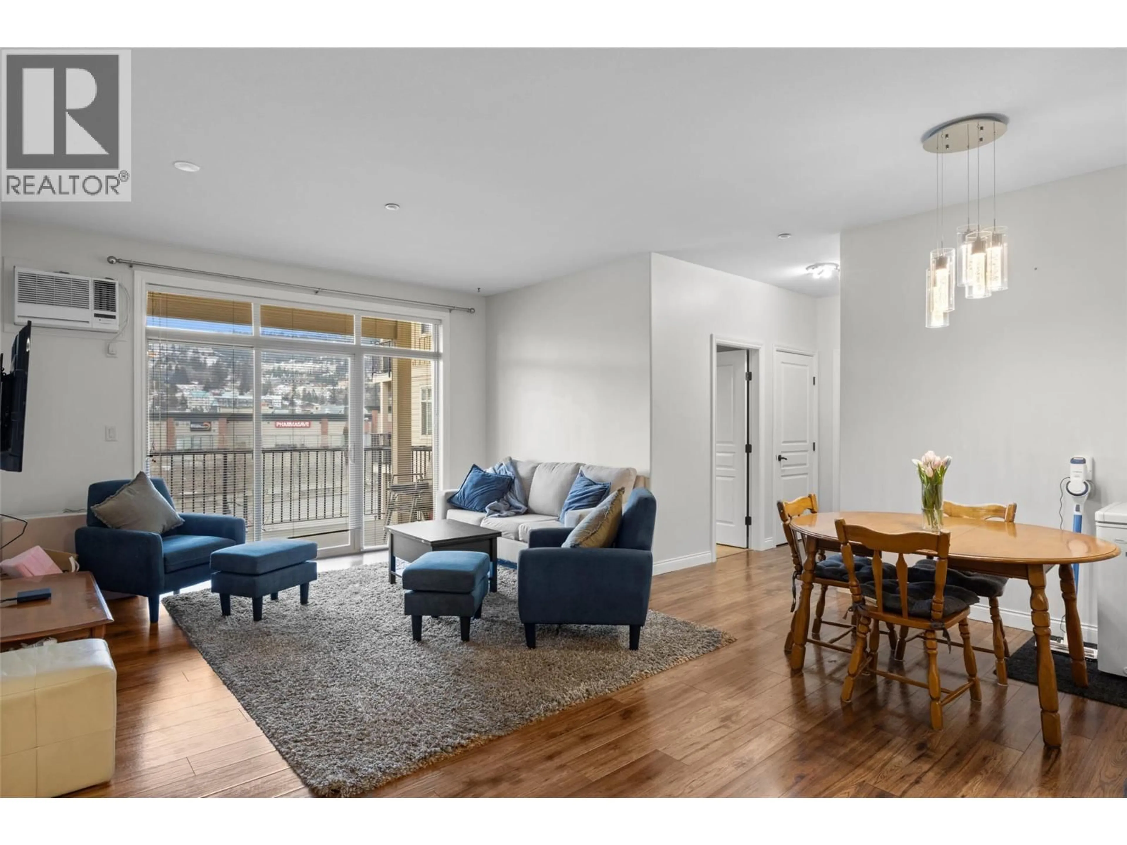Living room with furniture, wood/laminate floor for 214 - 1390 HILLSIDE DRIVE, Kamloops British Columbia V2E0A6