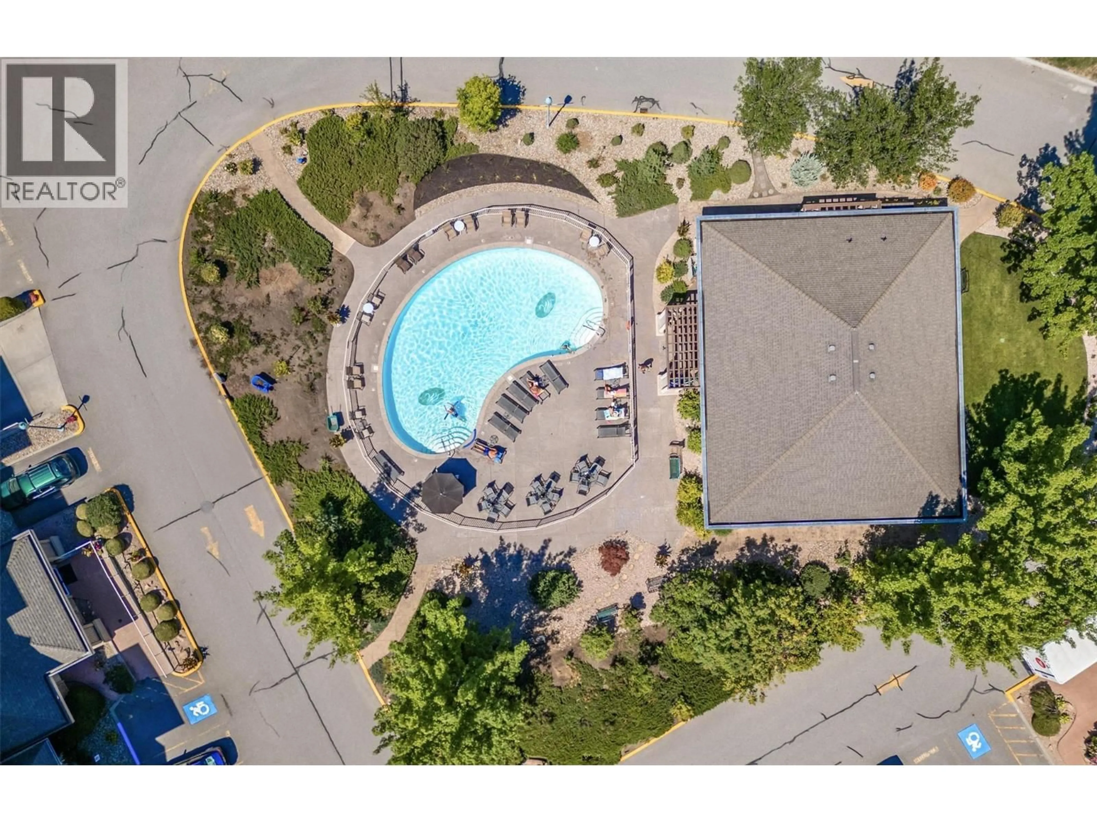 A pic from outside/outdoor area/front of a property/back of a property/a pic from drone, unknown for 412 - 1960 ENTERPRISE WAY, Kelowna British Columbia V1Y9S5