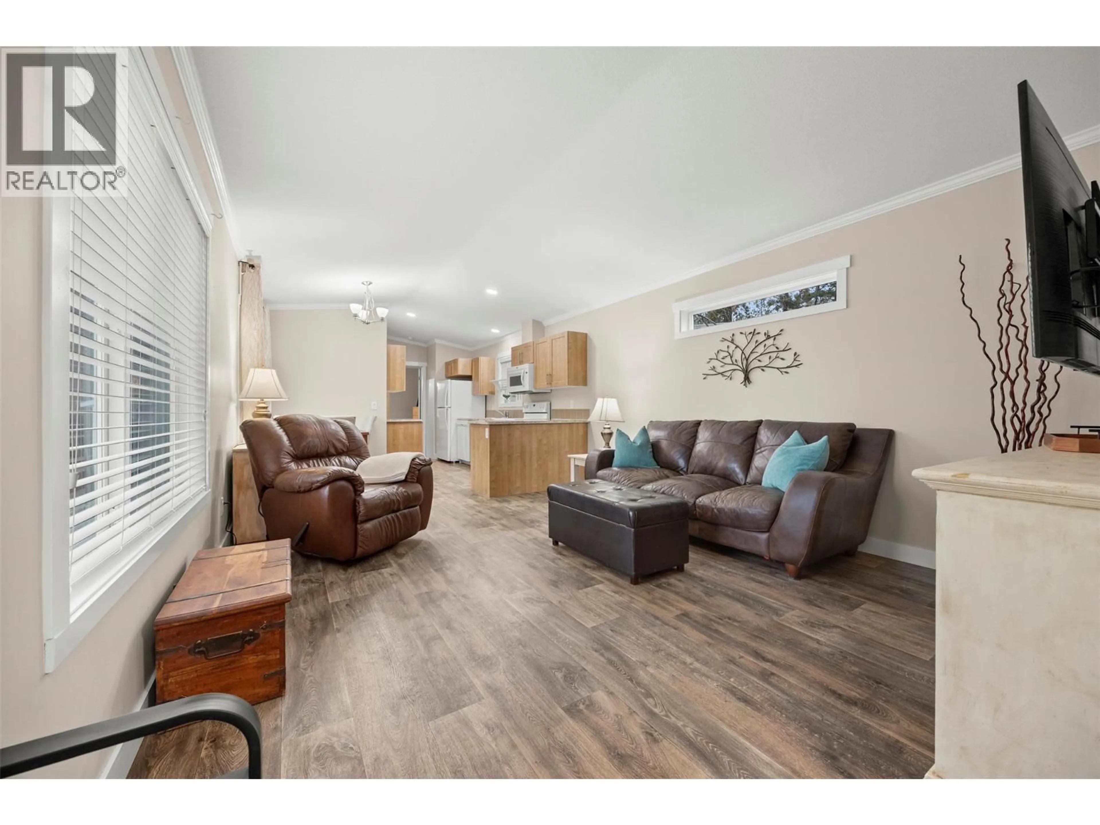 Living room with furniture, wood/laminate floor for 33 - 1860 BOUCHERIE ROAD, West Kelowna British Columbia V4T2A2