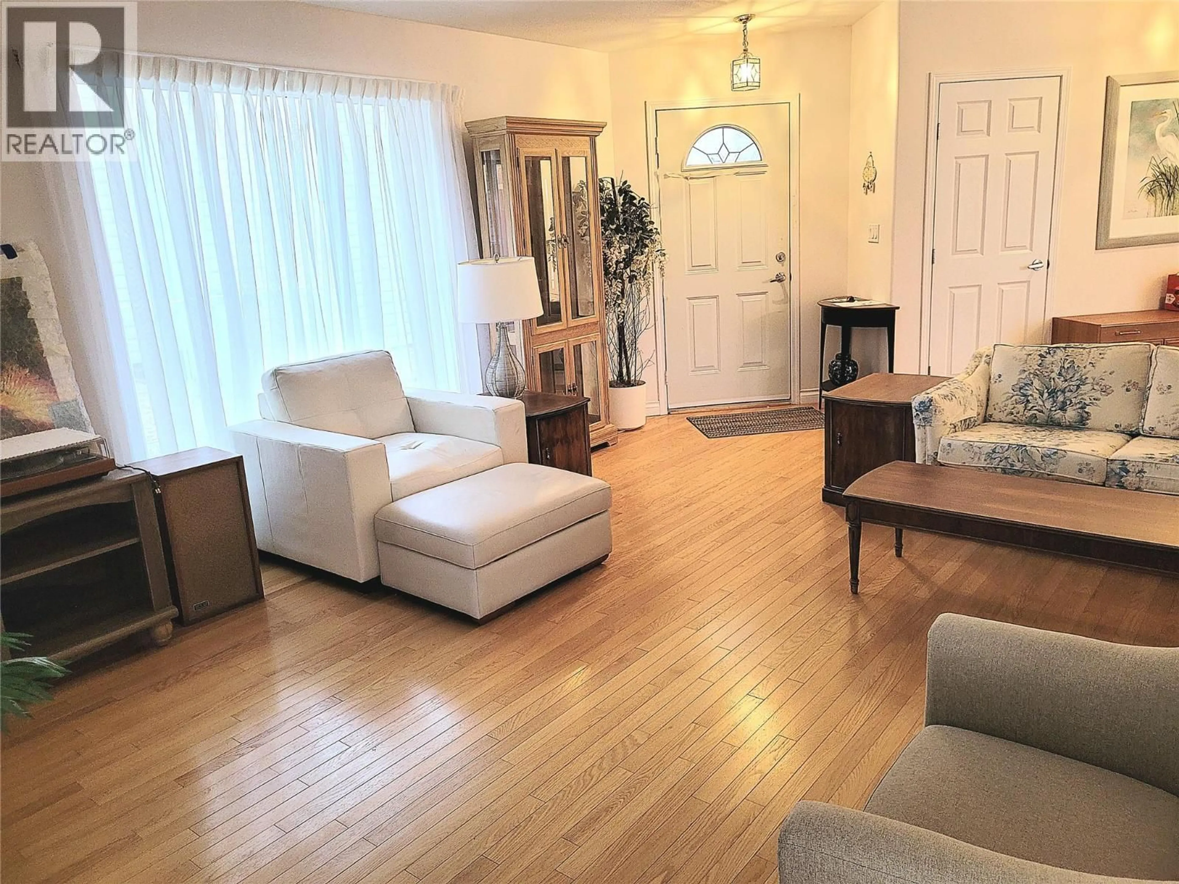 Living room with furniture, wood/laminate floor for 55 - 9400 115TH STREET, Osoyoos British Columbia V0H1V5