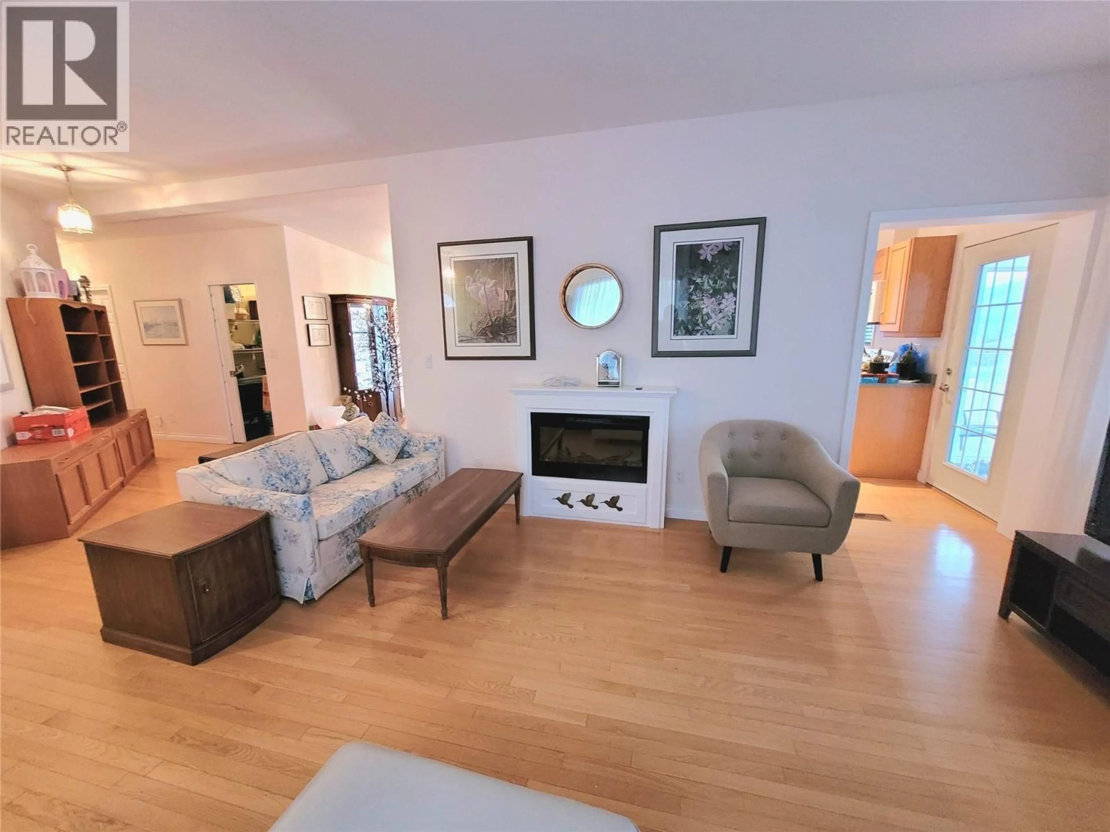 Living room with furniture, wood/laminate floor for 55 - 9400 115TH STREET, Osoyoos British Columbia V0H1V5