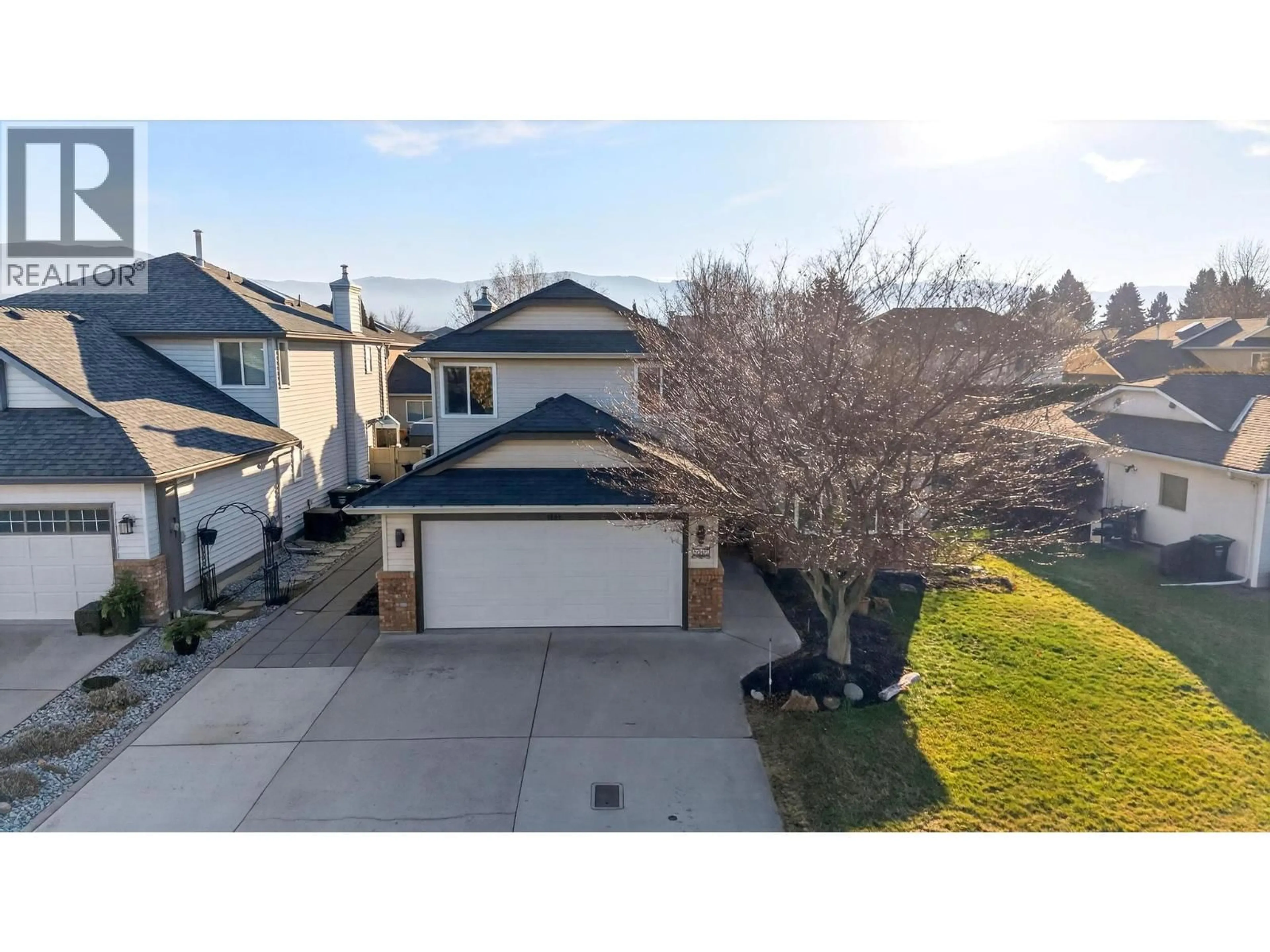 A pic from outside/outdoor area/front of a property/back of a property/a pic from drone, street for 1005 WINTERGREEN DRIVE, Kelowna British Columbia V1W3V7