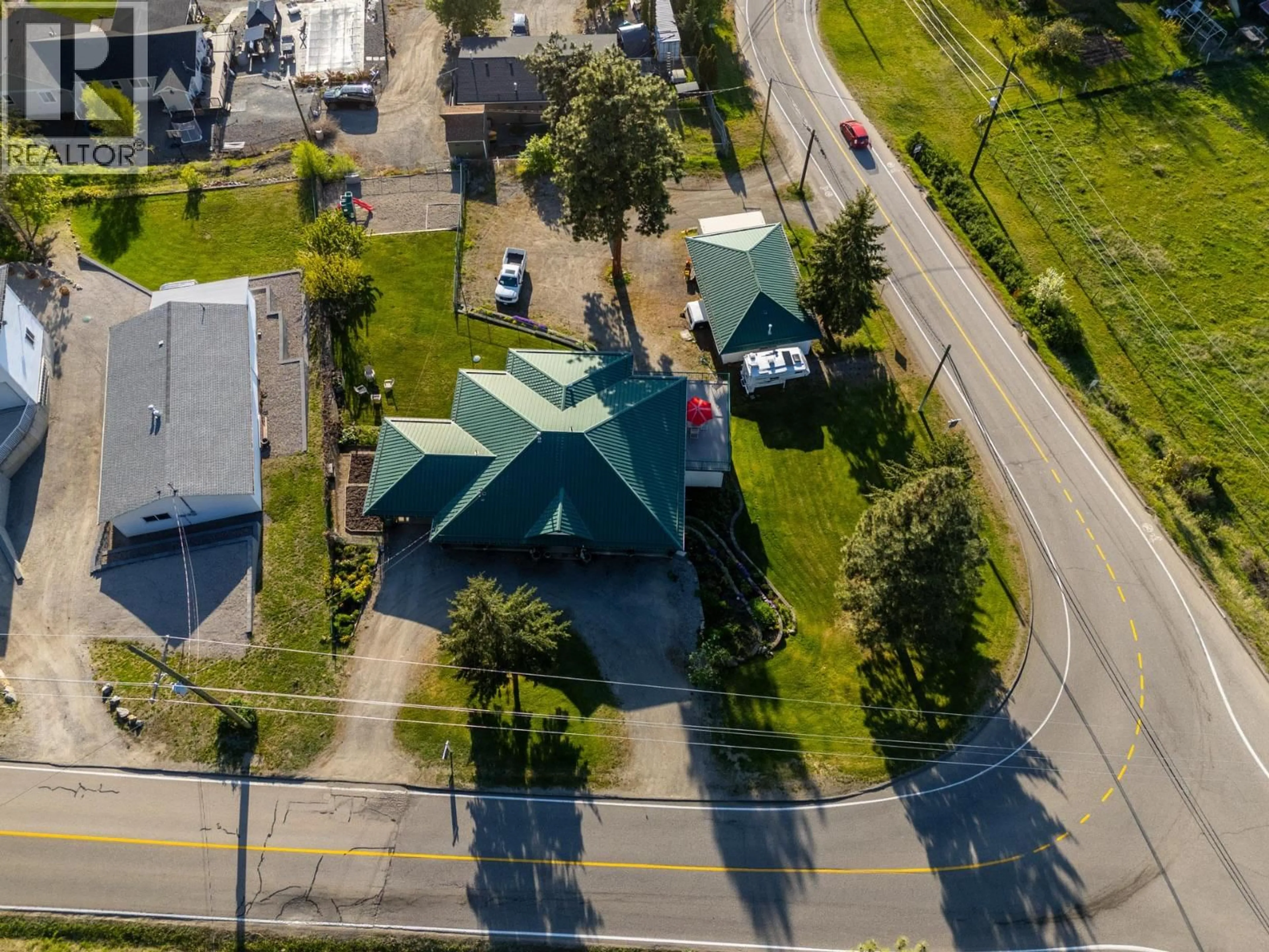 A pic from outside/outdoor area/front of a property/back of a property/a pic from drone, street for 15326 OYAMA ROAD, Lake Country British Columbia V4V2C5