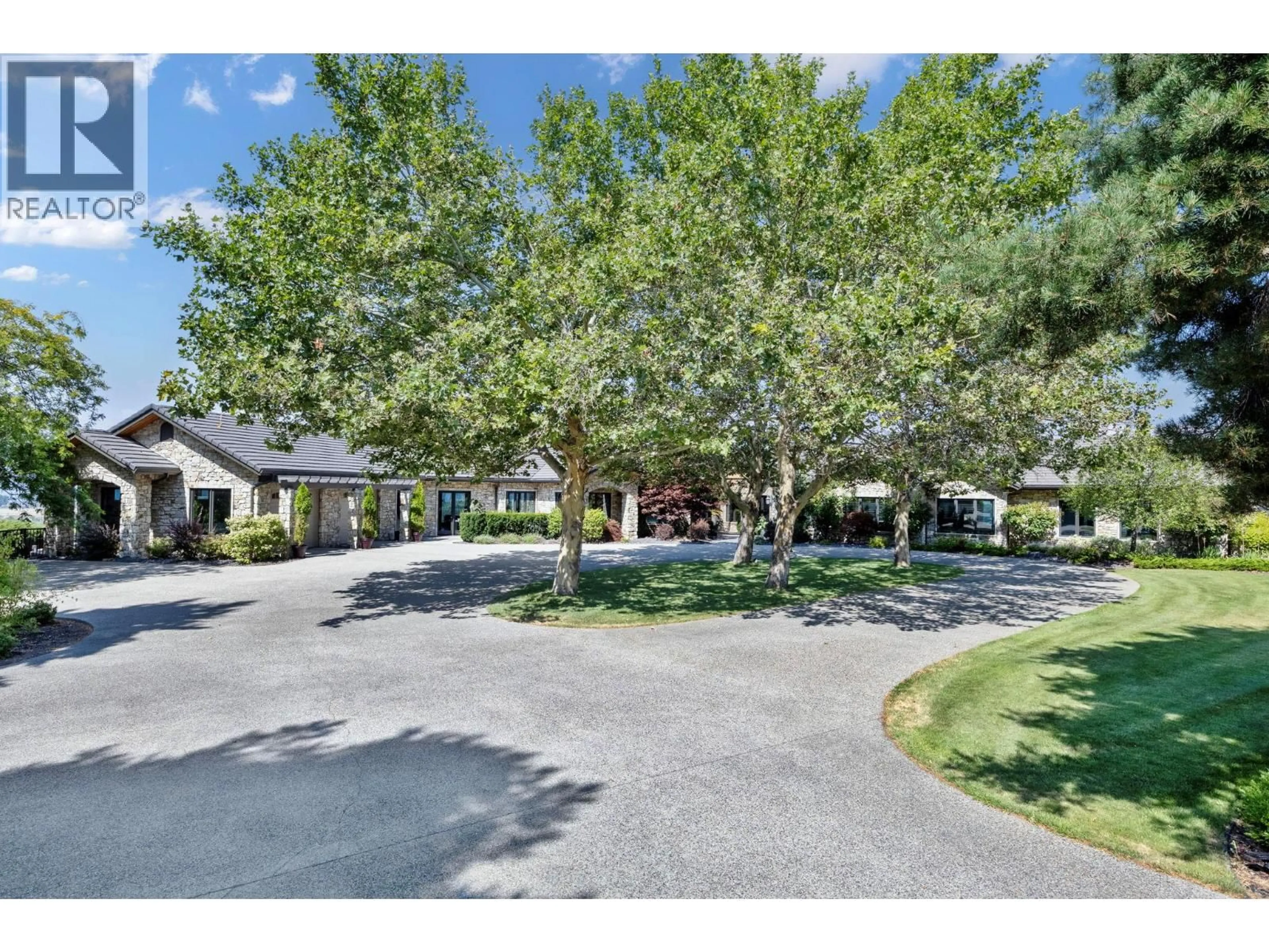 A pic from outside/outdoor area/front of a property/back of a property/a pic from drone, street for 4040 CASORSO ROAD, Kelowna British Columbia V1W4N6