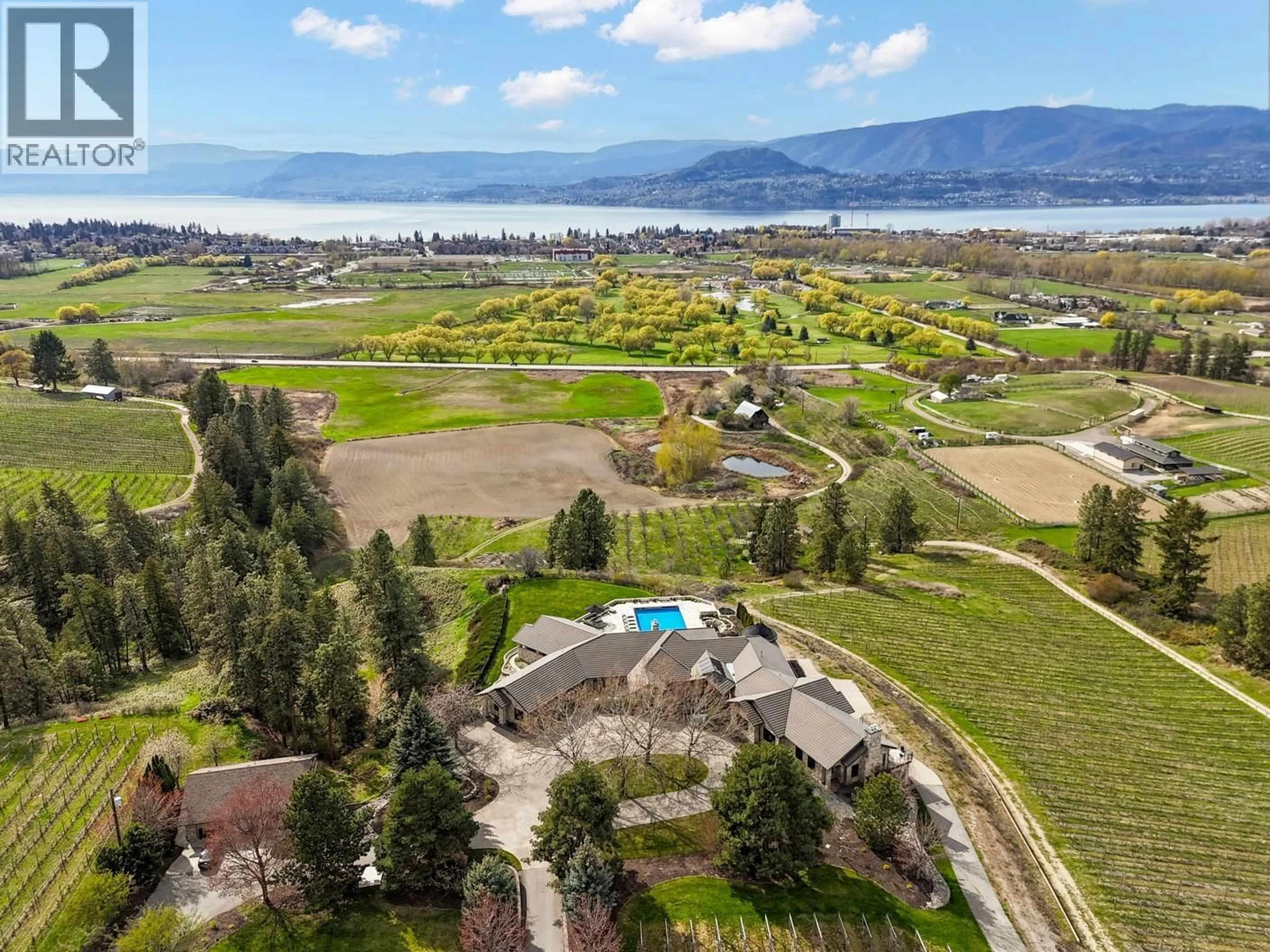 A pic from outside/outdoor area/front of a property/back of a property/a pic from drone, water/lake/river/ocean view for 4040 CASORSO ROAD, Kelowna British Columbia V1W4N6