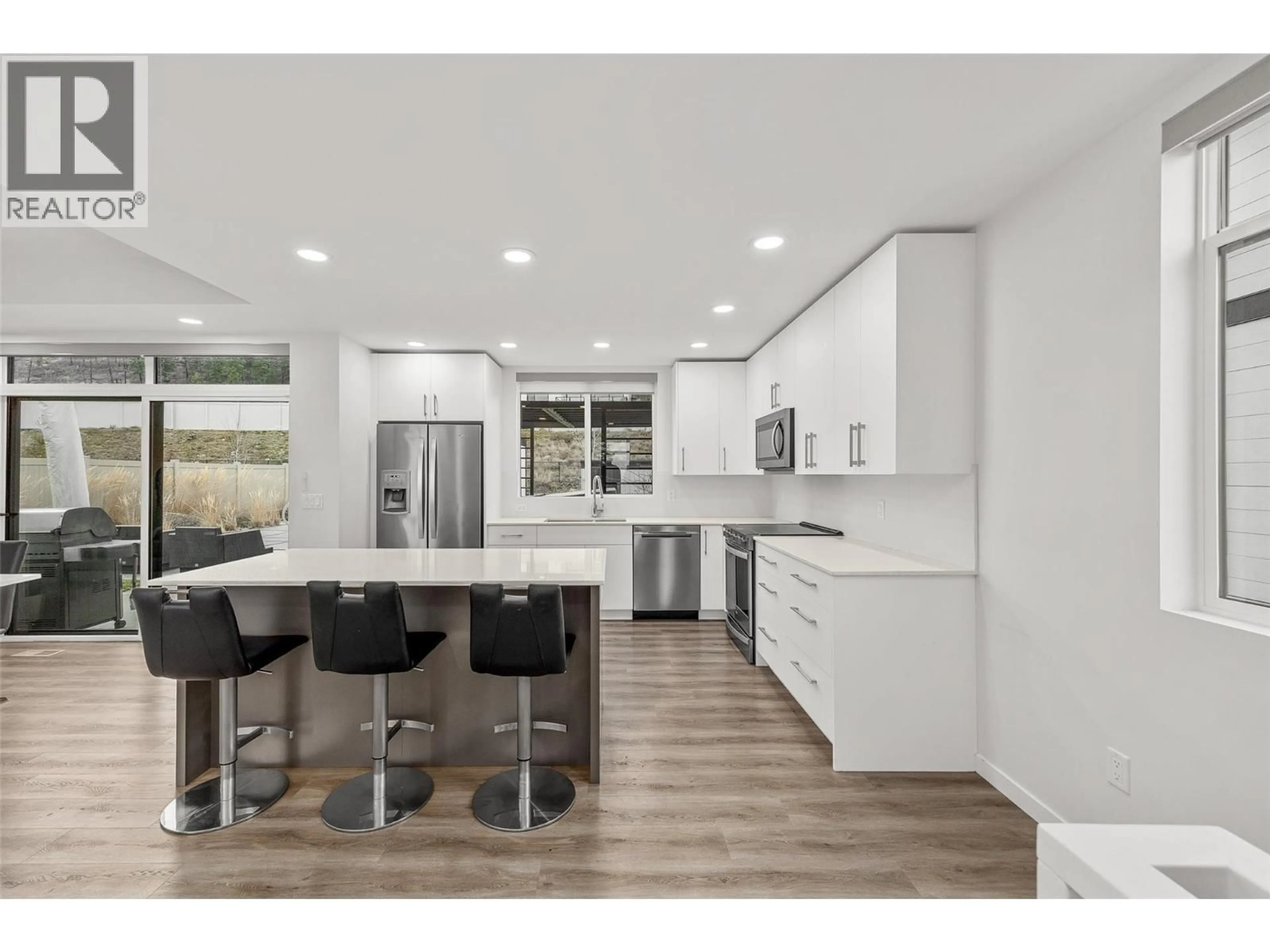 Open concept kitchen, wood/laminate floor for 3708 MORNINGSIDE DRIVE, West Kelowna British Columbia V4T0B1