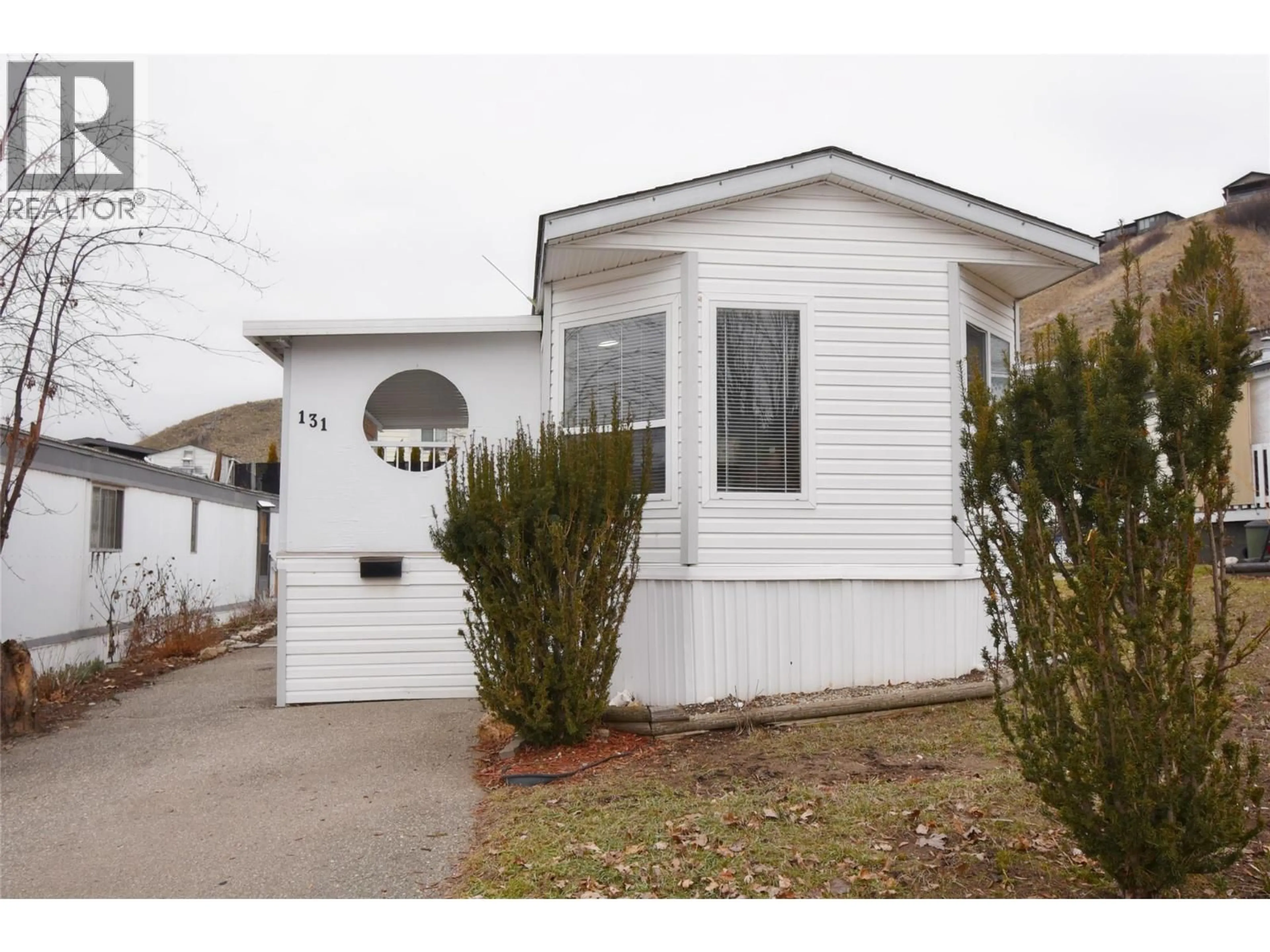 Home with vinyl exterior material, street for 131 - 15401 KALAMALKA ROAD, Coldstream British Columbia V1B1Z3