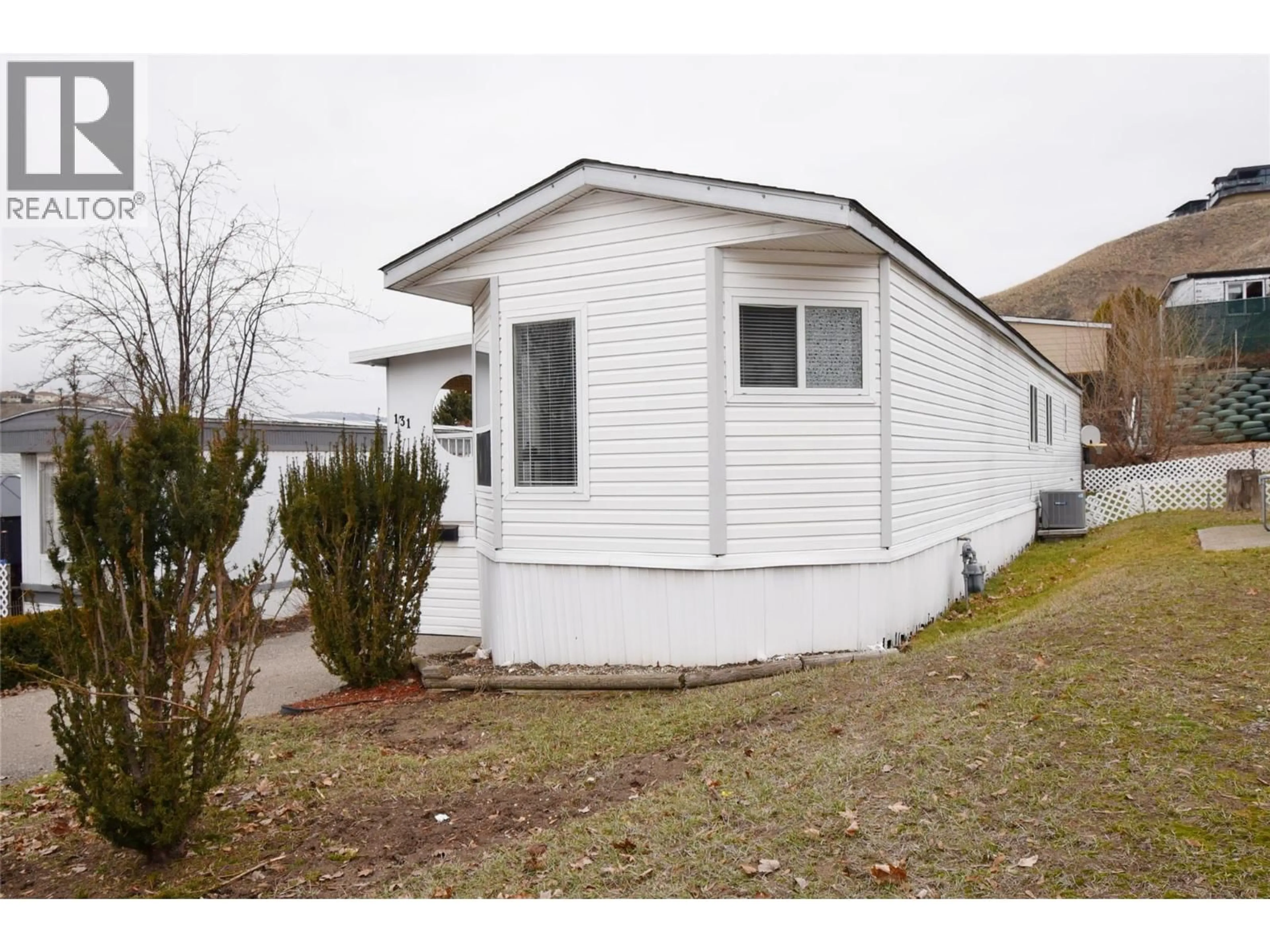 Home with vinyl exterior material, street for 131 - 15401 KALAMALKA ROAD, Coldstream British Columbia V1B1Z3