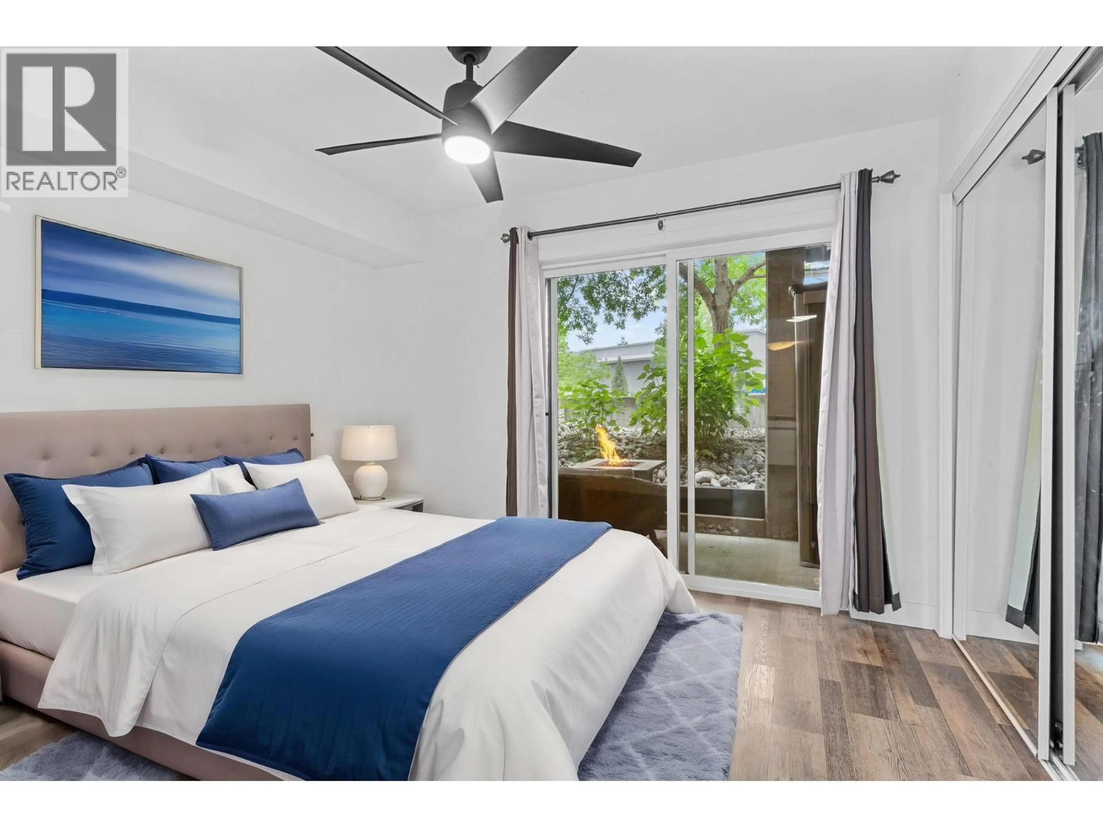 Bedroom with bed, wood/laminate floor for 205 - 2585 HEBERT ROAD, West Kelowna British Columbia V4T2W4