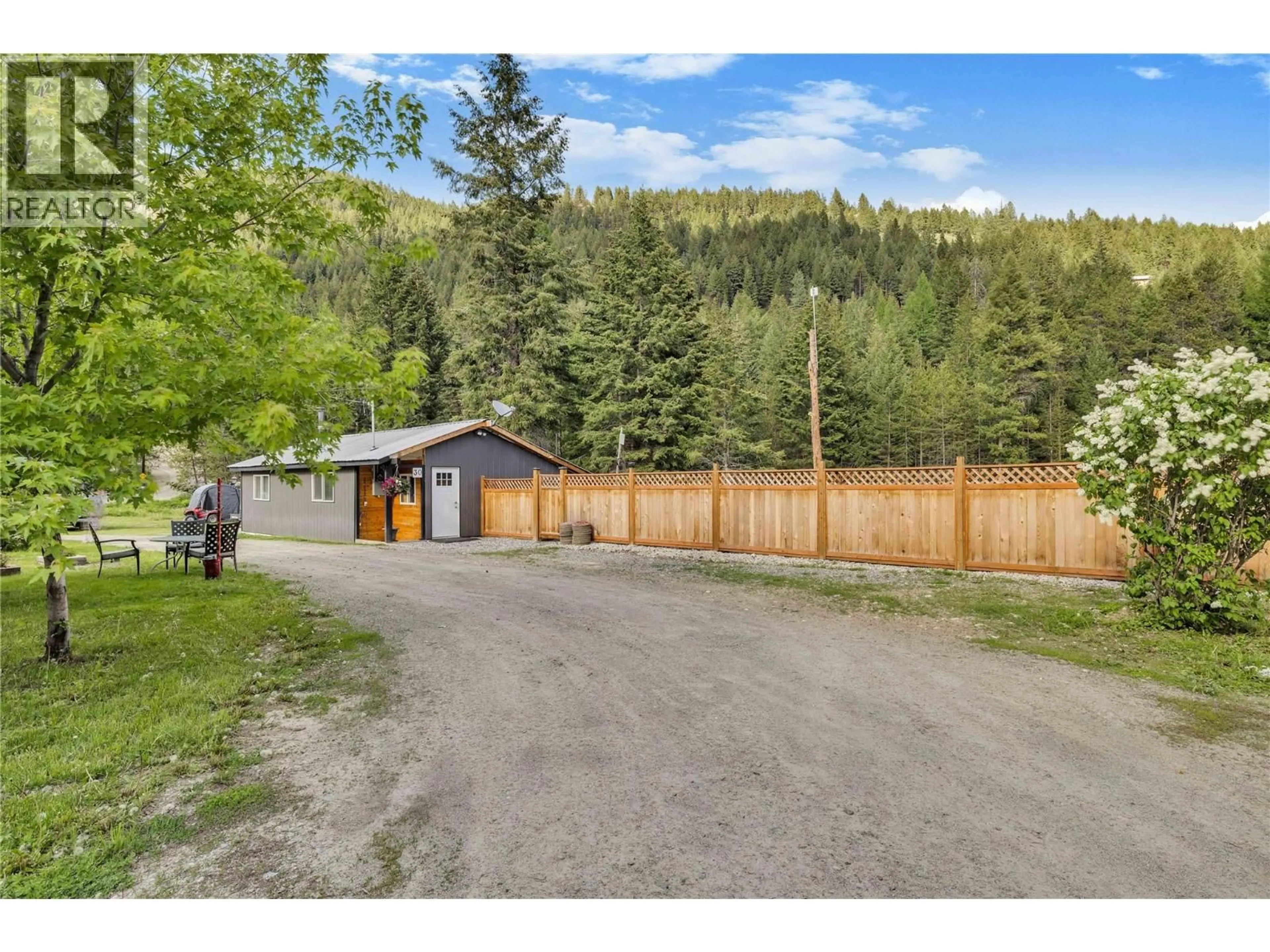 A pic from outside/outdoor area/front of a property/back of a property/a pic from drone, mountain view for 30 BOULDER ROAD, Beaverdell British Columbia V0H1A0