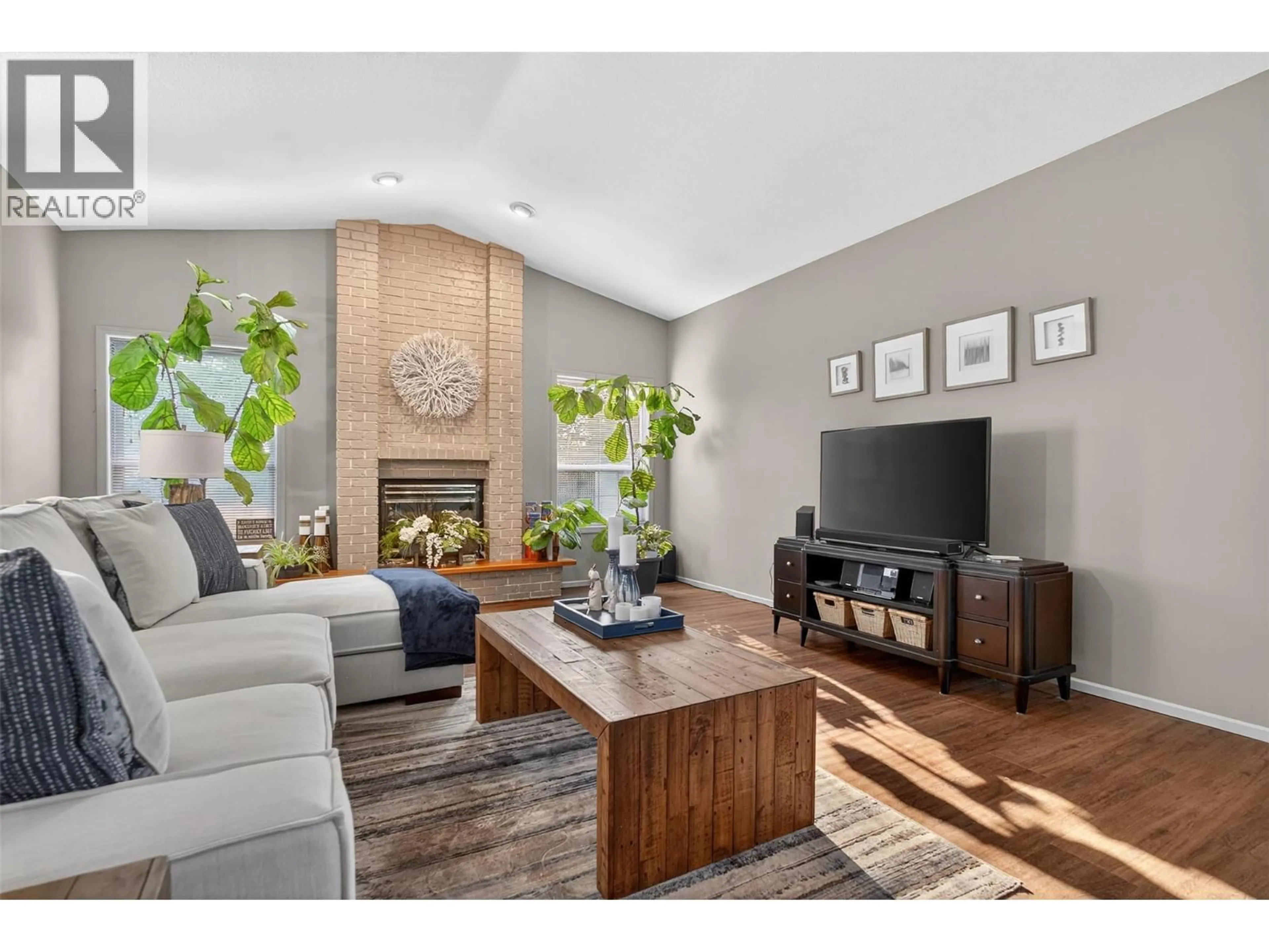 Living room with furniture, wood/laminate floor for 407 - 2330 BUTT ROAD, West Kelowna British Columbia V4T2L3