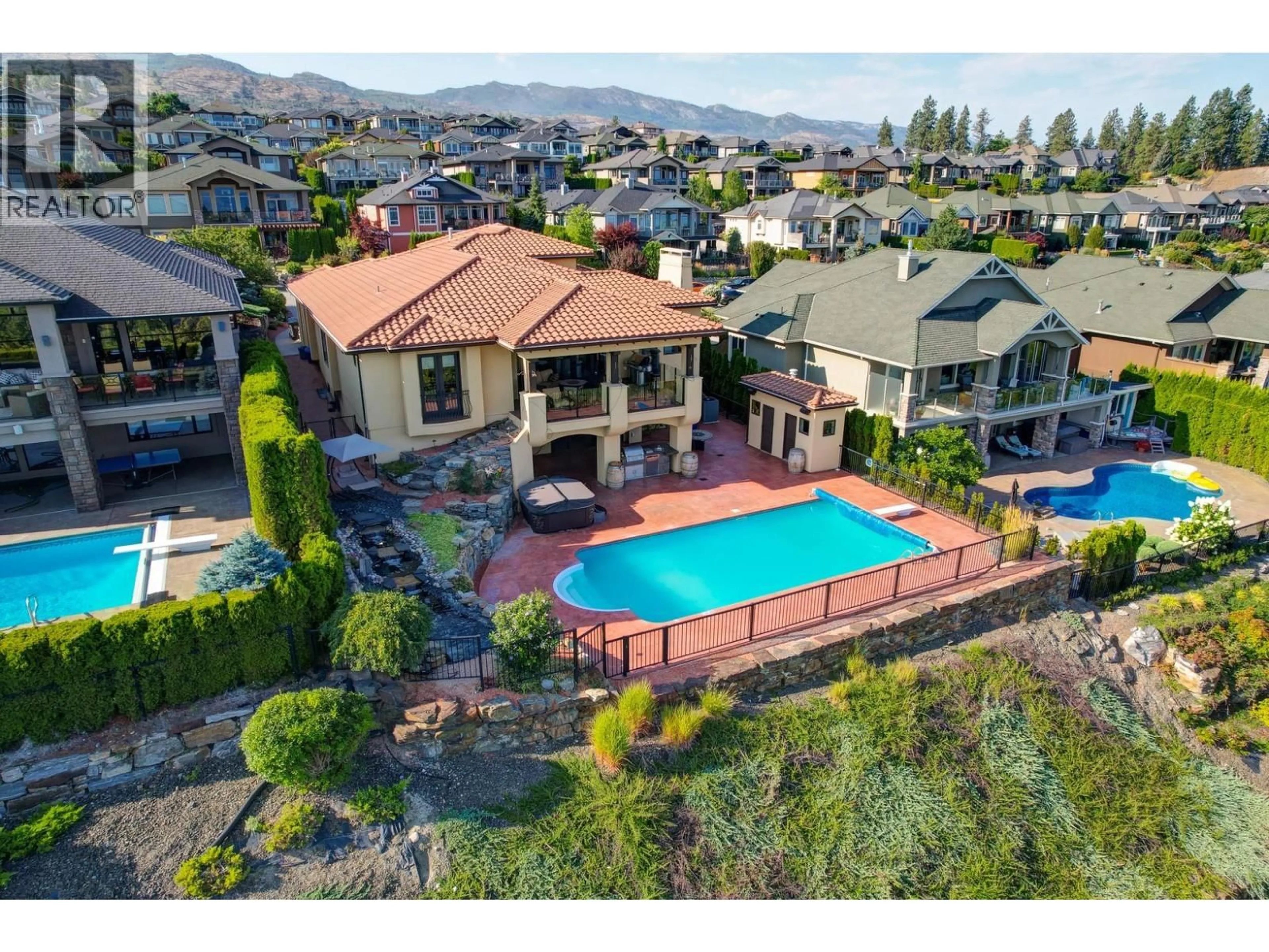 A pic from outside/outdoor area/front of a property/back of a property/a pic from drone, mountain view for 660 ALMANDINE COURT, Kelowna British Columbia V1W4Z5