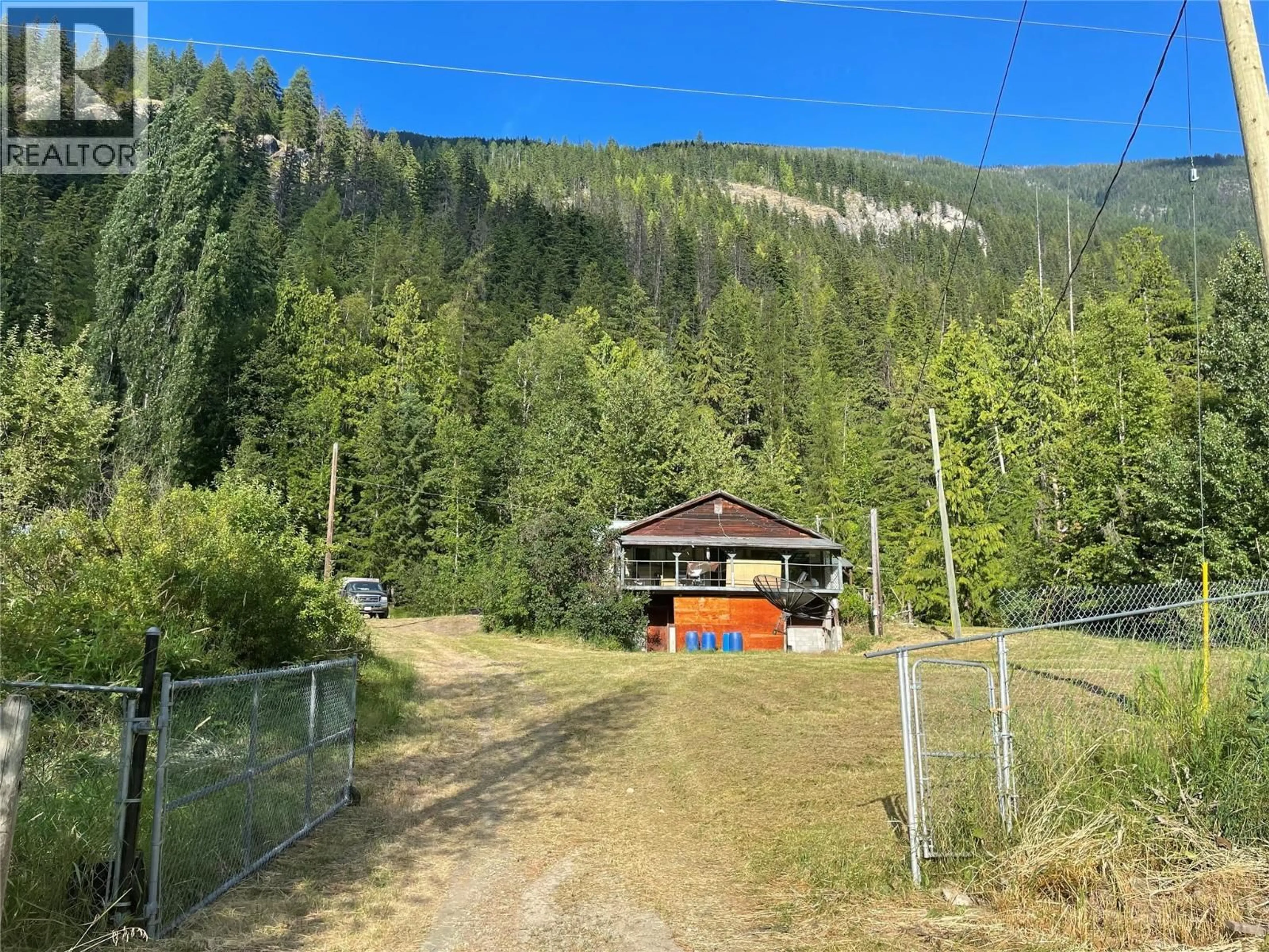 A pic from outside/outdoor area/front of a property/back of a property/a pic from drone, mountain view for 4577 6 HIGHWAY, Burton British Columbia V0G1E0