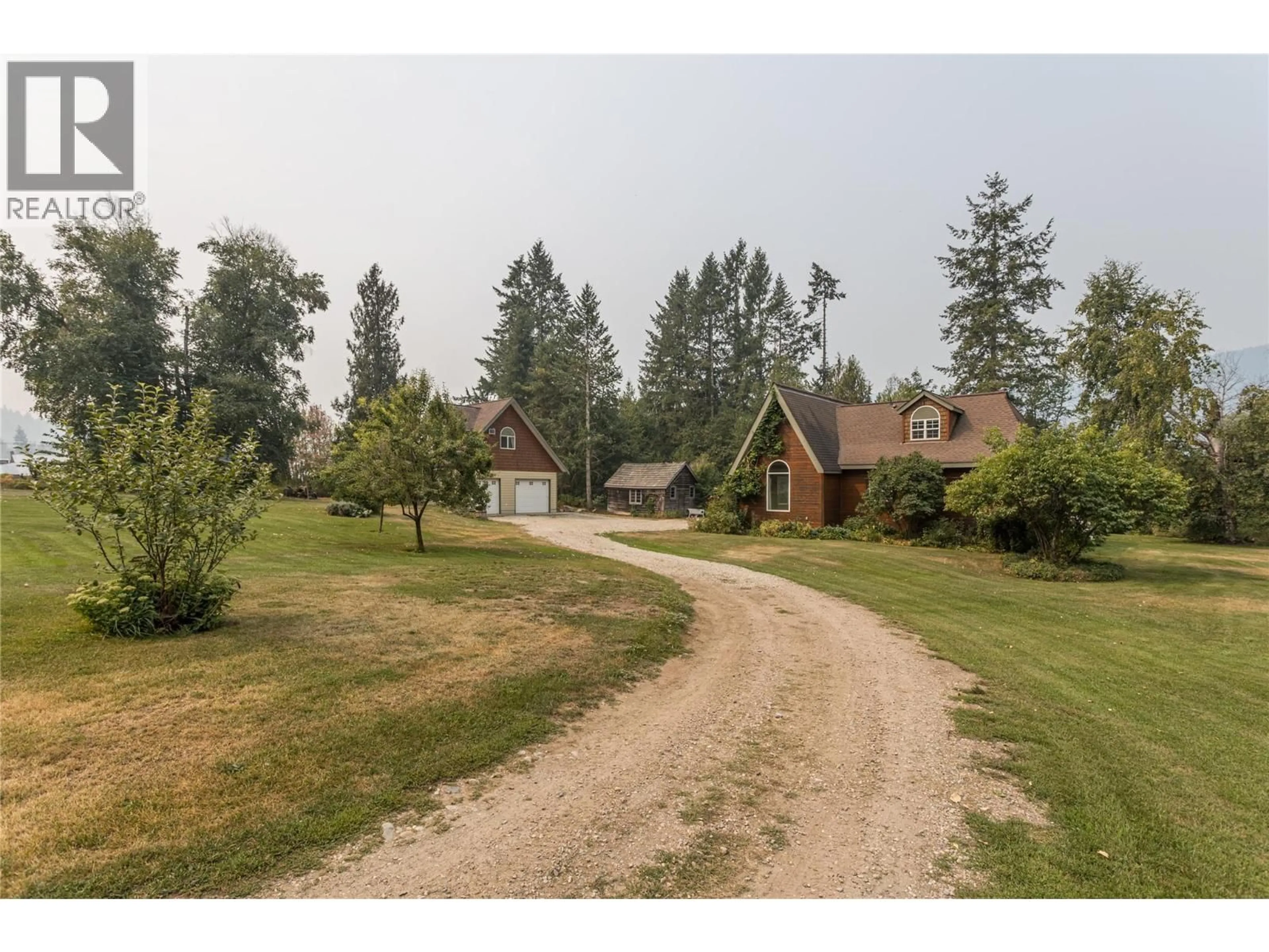 A pic from outside/outdoor area/front of a property/back of a property/a pic from drone, unknown for 7704 97A HIGHWAY, Mara British Columbia V0E2K0