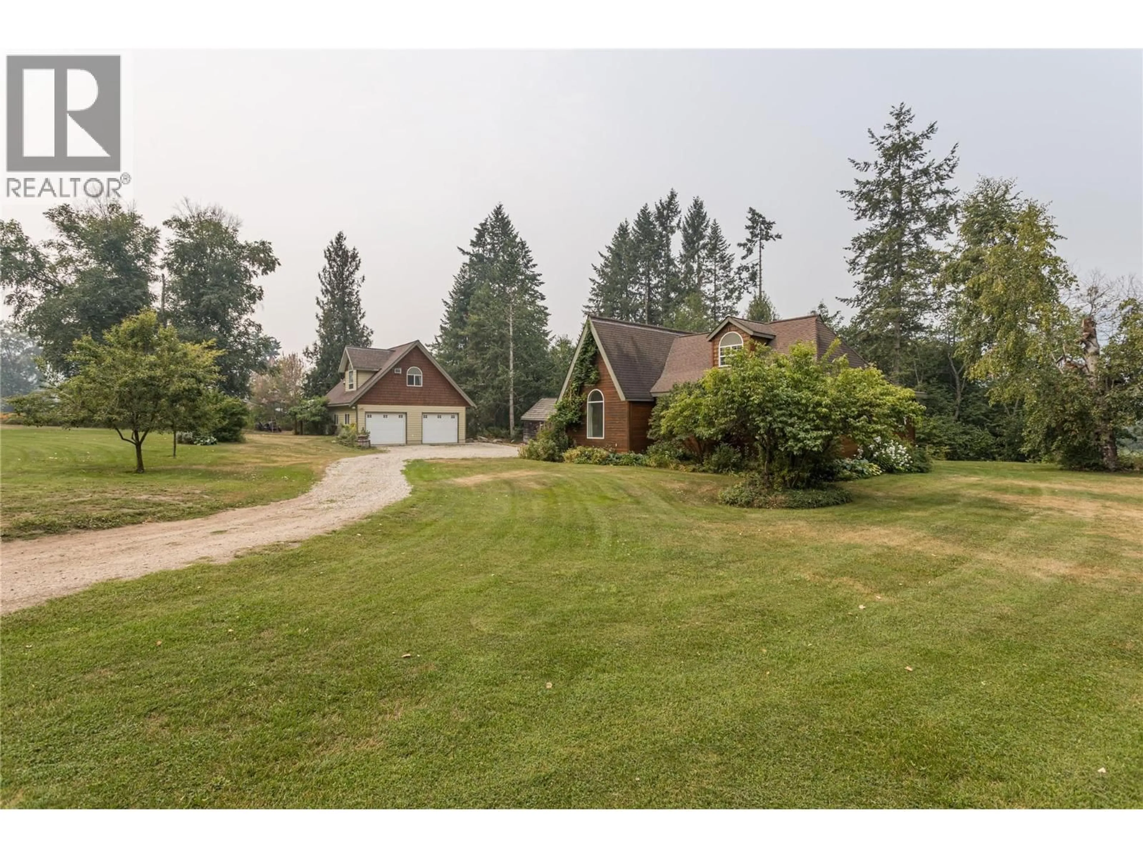 A pic from outside/outdoor area/front of a property/back of a property/a pic from drone, unknown for 7704 97A HIGHWAY, Mara British Columbia V0E2K0