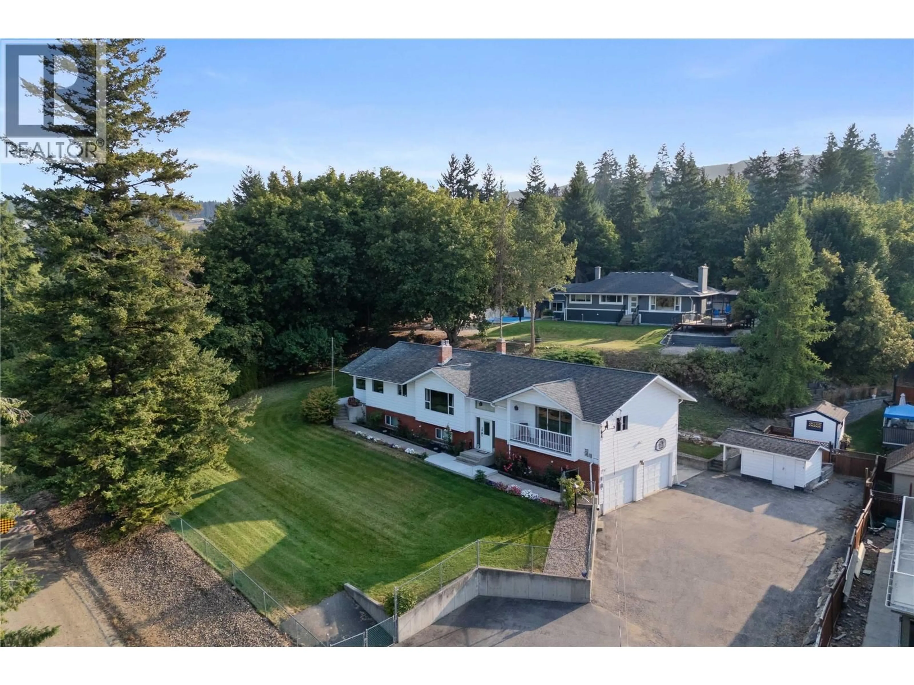 A pic from outside/outdoor area/front of a property/back of a property/a pic from drone, mountain view for 1541 20 AVENUE NORTHEAST, Salmon Arm British Columbia V1E3X8