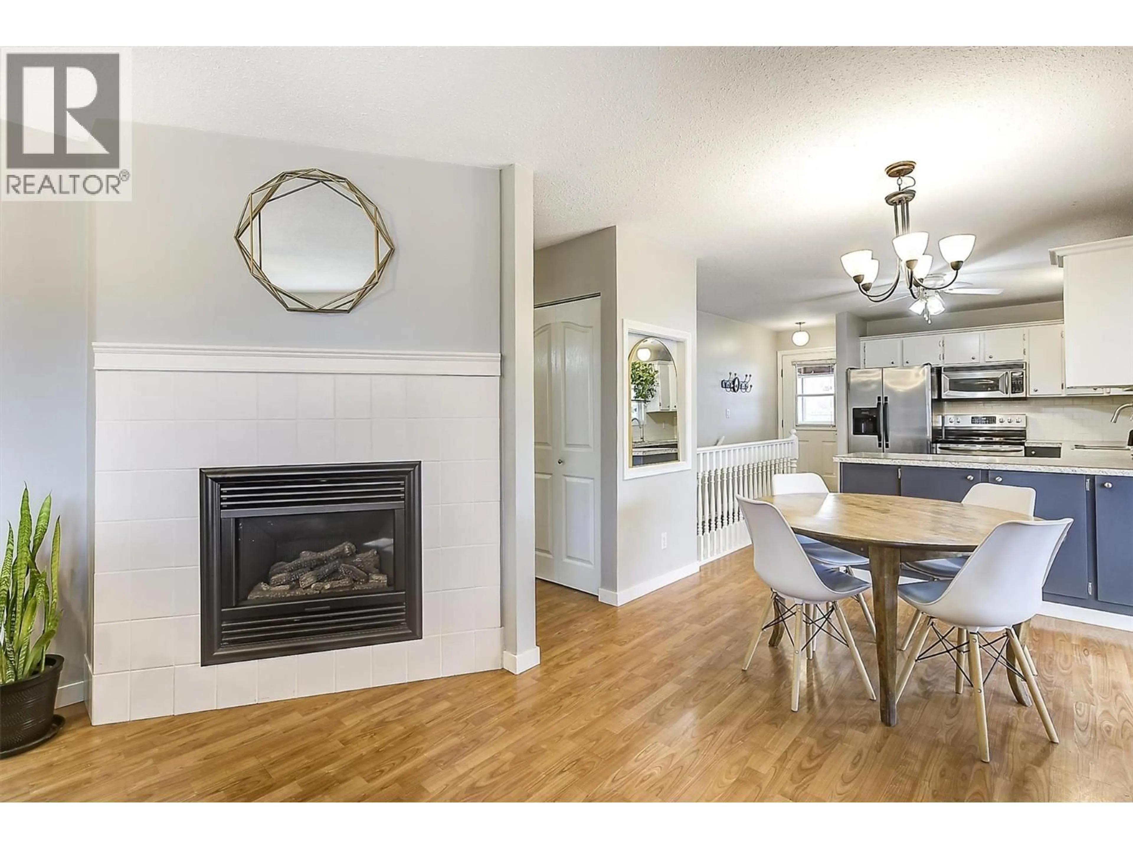 Open concept kitchen, wood/laminate floor for 10892 RUSSELL ROAD, Lake Country British Columbia V4V1W6