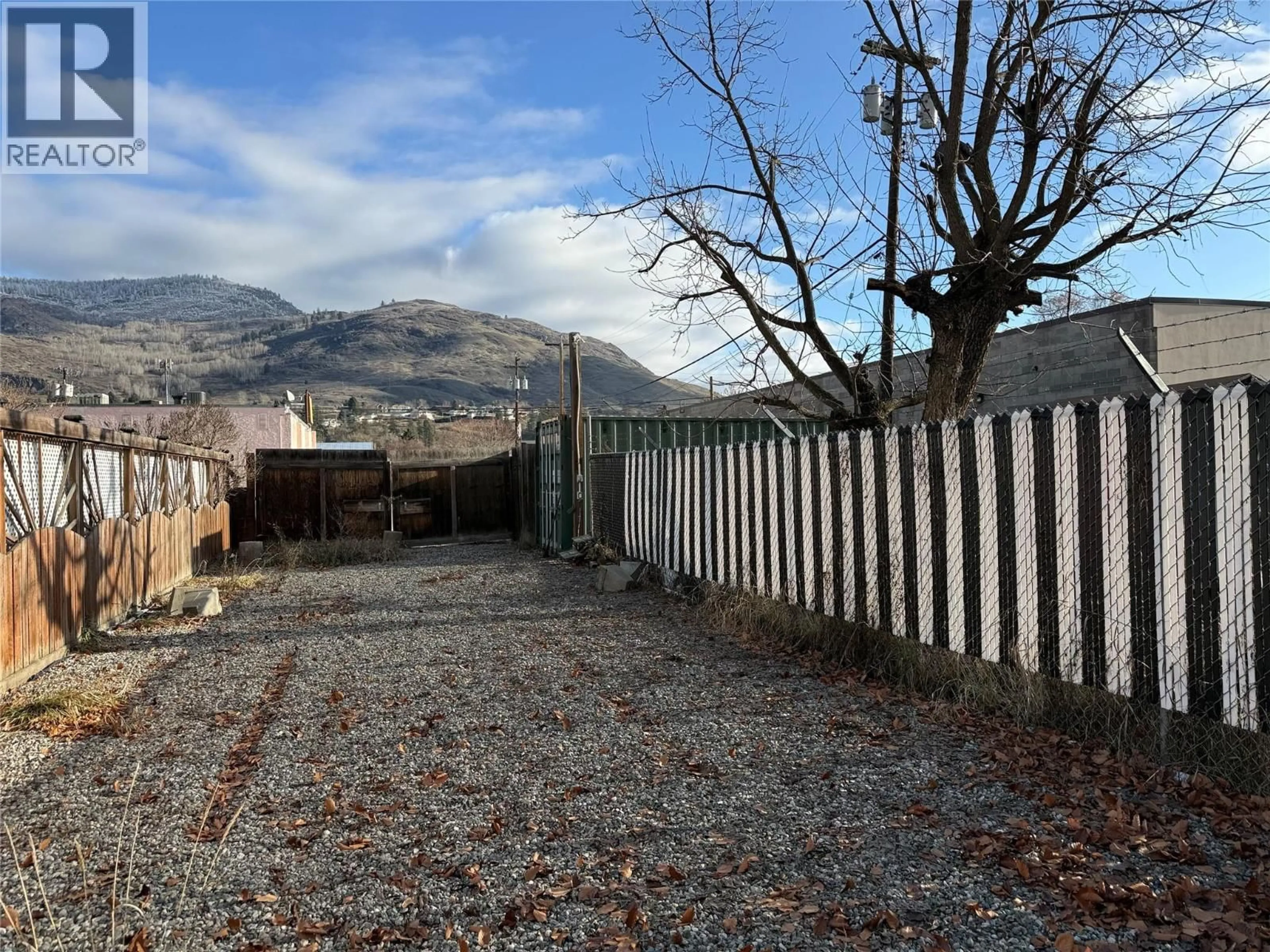 A pic from outside/outdoor area/front of a property/back of a property/a pic from drone, mountain view for 7441 6TH STREET, Grand Forks British Columbia V0H1H0